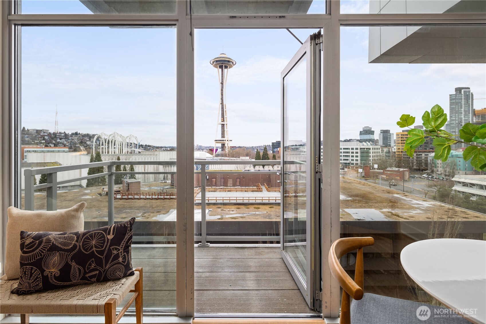 Urban luxury meets effortless living on the 11th level of Gallery, one of North Belltown’s most refined full-service buildings. Floor-to-ceiling windows showcase a striking Space Needle view that feels close and immersive, bringing the energy of the city right into your home. Ideally located just steps from Climate Pledge Arena, the Opera, The REP, KEXP, and some of Seattle’s best restaurants and nightlife. Pike Place Market, the new Waterfront Park, and Olympic Sculpture Park are all within easy reach. This is true lock-and-leave living in a building known for being elegant, secure, and exceptionally well managed. Gallery offers an impressive suite of amenities, including a rooftop deck perfect for sunset views and late-night dog walks, a sky lounge with fire pits and sweeping Needle and Olympic views, and a newly renovated owners lounge featuring a chef’s kitchen, shuffleboard, theatre room, and premium sound system. Two guest suites, a spa-level dog wash, rotating curated art installations, and 24/7 concierge service complete the experience. Sophisticated, efficient, and unmistakably Seattle.