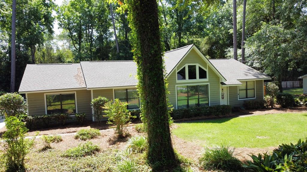 Discover this charming three-bedroom, two-bathroom house, offering 1,800 square feet of living space on a spacious .42-acre lot. This inviting property features a bright cathedral living room with a cozy fireplace, a separate dining room, and a bonus living room perfect for a play area or home office. Enjoy the beautifully landscaped backyard with a covered seating area and a dedicated kids' play area, along with the convenience of a carport. Located in a desirable neighborhood, this family-friendly home is perfect for those looking to grow and thrive in a welcoming community. 3D tour can be seen here. https://my.matterport.com/show/?m=mcVGWztMfWm