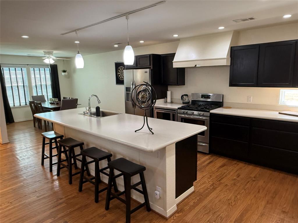 A rare gem in an established neighborhood near the Dallas Arboretum and White Rock Lake.  This 3 bedroom, 2 bath home has the original hardwood floors.  The kitchen, dining and living room are all open and spacious. Kitchen has large stainless farm sink on an oversized breakfast island, gas stove with 5 burners, walk-in pantry and stackable washer-dryer closet.  The primary bedroom is split from the guest bedrooms and features a walk-in closet and private bathroom.  All bedrooms have ceiling fans.  Guest bath has linen closet behind the door.  Coat closet at the entry and another in the hallway to bedrooms.  Home has had electric panel replaced with new wiring, cast iron plumbing replaced with PVC under the house as well as to the alley, gutters added, 8' wood board on board fence across back yard, 6' wood fence on sides and front, patio cover and wood deck, Tuff storage shed, tankless hot water heater, double paned windows (can be cleaned from inside) and all updated appliances and lighting fixtures. HVAC replaced August 2024, foam insulation in attic, hardi plank exterior siding, prewired for cat5e cables for exterior cameras.