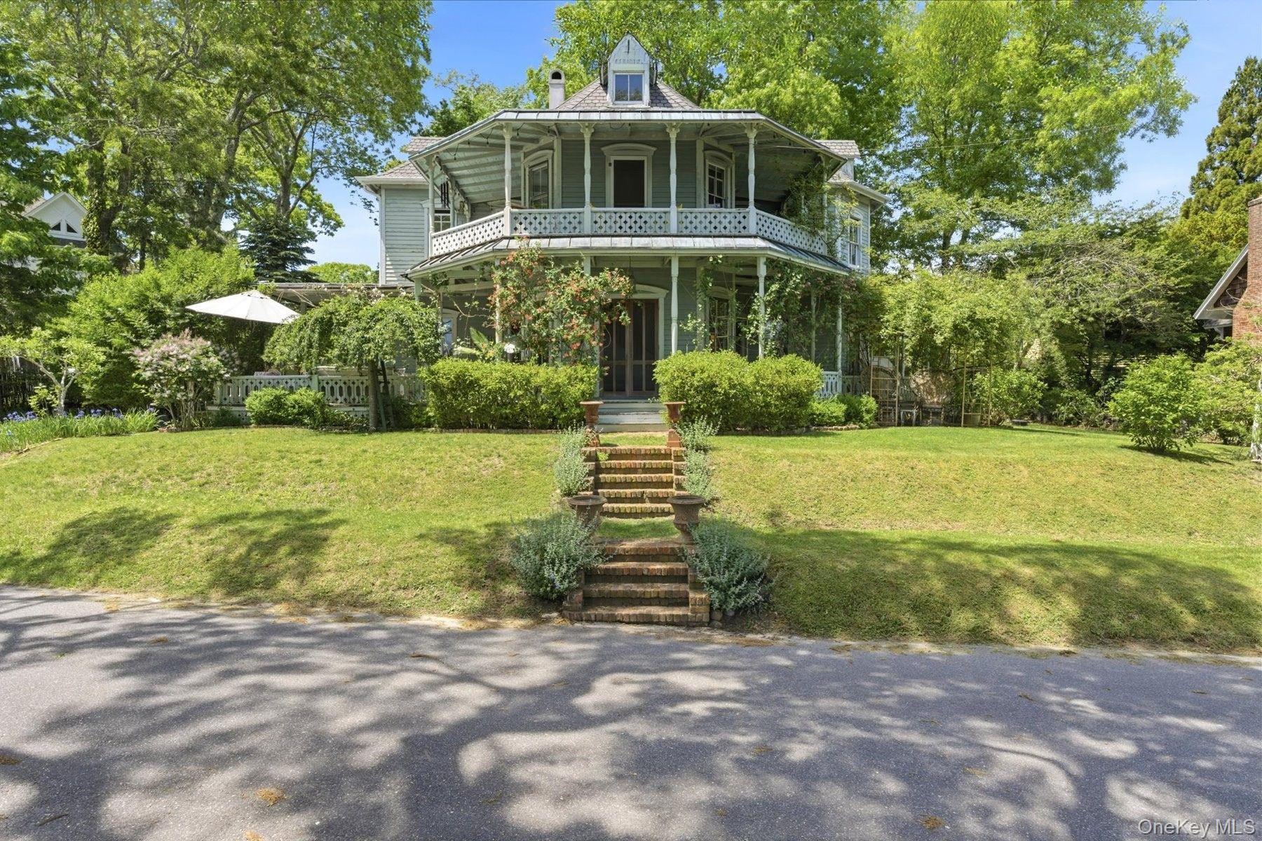 Dating back to the original 1871 layout of the Shelter Island Grove and Camp Meeting Association, Spring Garden Avenue is celebrated for its organic, rolling streetscapes and preserved 19th-century architecture. 5 Spring Garden Avenue is an authentic 1880 Victorian residence that embodies the classic style of the era, from its steeply pitched rooflines to its expansive exterior woodwork.The interior layout is expansive and true to its vintage, characterized by distinctive octagonal rooms on both the first and second floors. With five bedrooms, a sprawling third-floor attic loft, and a substantial footprint of covered decks and porches, the home offers a generous canvas within a historic setting.A significant structural update was completed in 2008, replacing the older foundation with a new poured concrete basement and structural footings, alongside the installation of a new roof. Featuring full access to the Shelter Island Heights Association tennis courts and beach club, this property represents an authentic piece of island history.