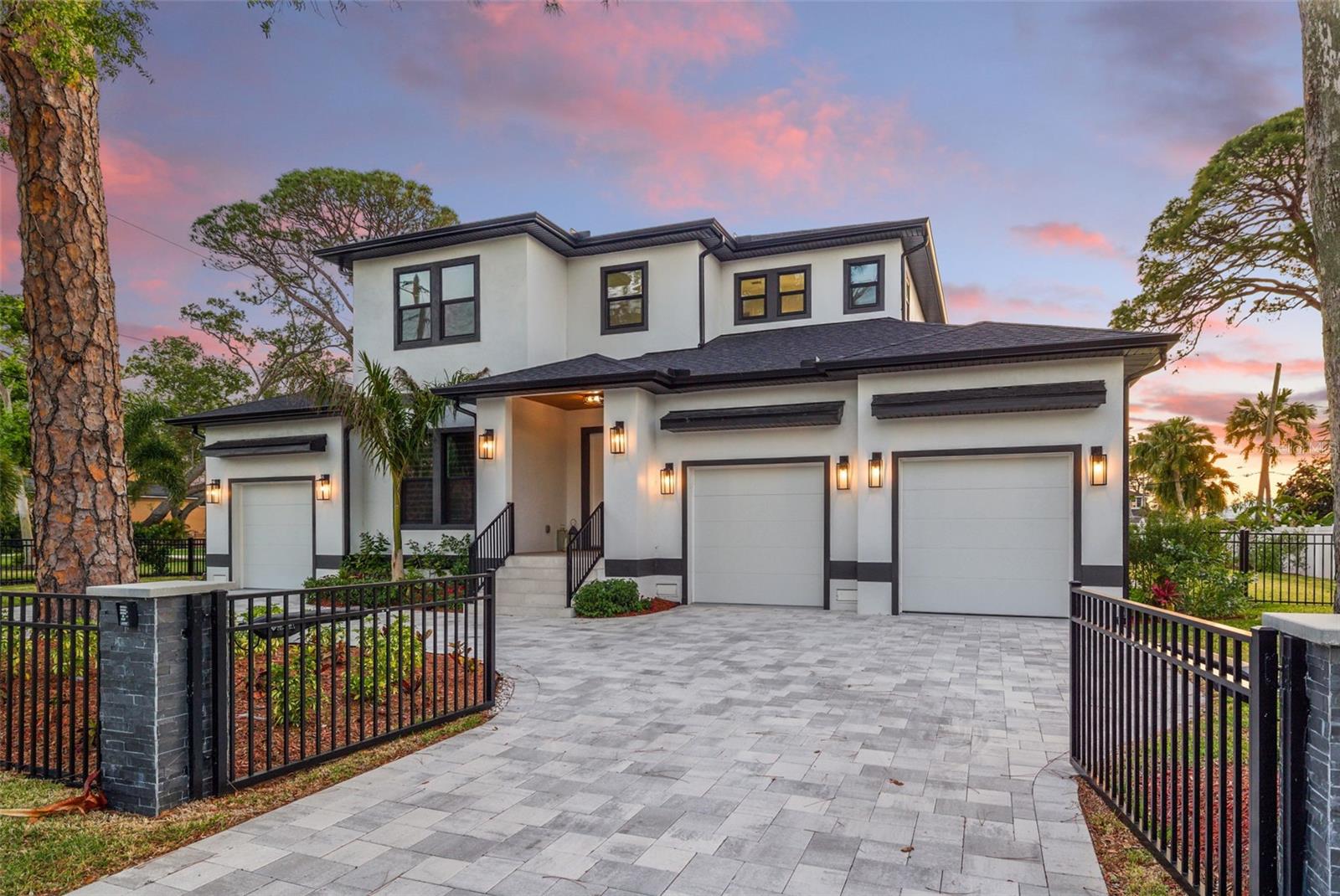 Welcome to 1542 Bayshore Blvd, Dunedin, FL — where modern luxury meets coastal charm. This brand-new 2024 contemporary residence offers over 3,500 square feet of thoughtfully designed living space, complete with 4 spacious bedrooms, 3 elegant bathrooms, a 3-car garage, and a resort-style pool perfect for Florida living.

Step inside to soaring ceilings, expansive open-concept living areas, and walls of glass that flood the home with natural light. The gourmet kitchen features sleek quartz countertops, custom cabinetry, high-end stainless appliances, and a generous island — ideal for both casual family meals and entertaining.

The luxurious primary suite is a true retreat with a spa-like ensuite bathroom, oversized walk-in closet, and private access to the outdoor oasis. Each additional bedroom is generously sized and beautifully appointed, offering comfort and privacy for family or guests.

Outside, enjoy your own tropical paradise with a covered lanai, sparkling pool, and ample space to entertain or relax in the sun. The oversized 3-car garage provides plenty of room for vehicles, storage, or even a home gym or workshop.

Located just minutes from vibrant downtown Dunedin, award-winning beaches, and the scenic Pinellas Trail, this home offers the perfect balance of sophistication, space, and location.

Don’t miss your chance to own a slice of modern paradise in one of Florida’s most sought-after coastal communities. Schedule your private tour today!
