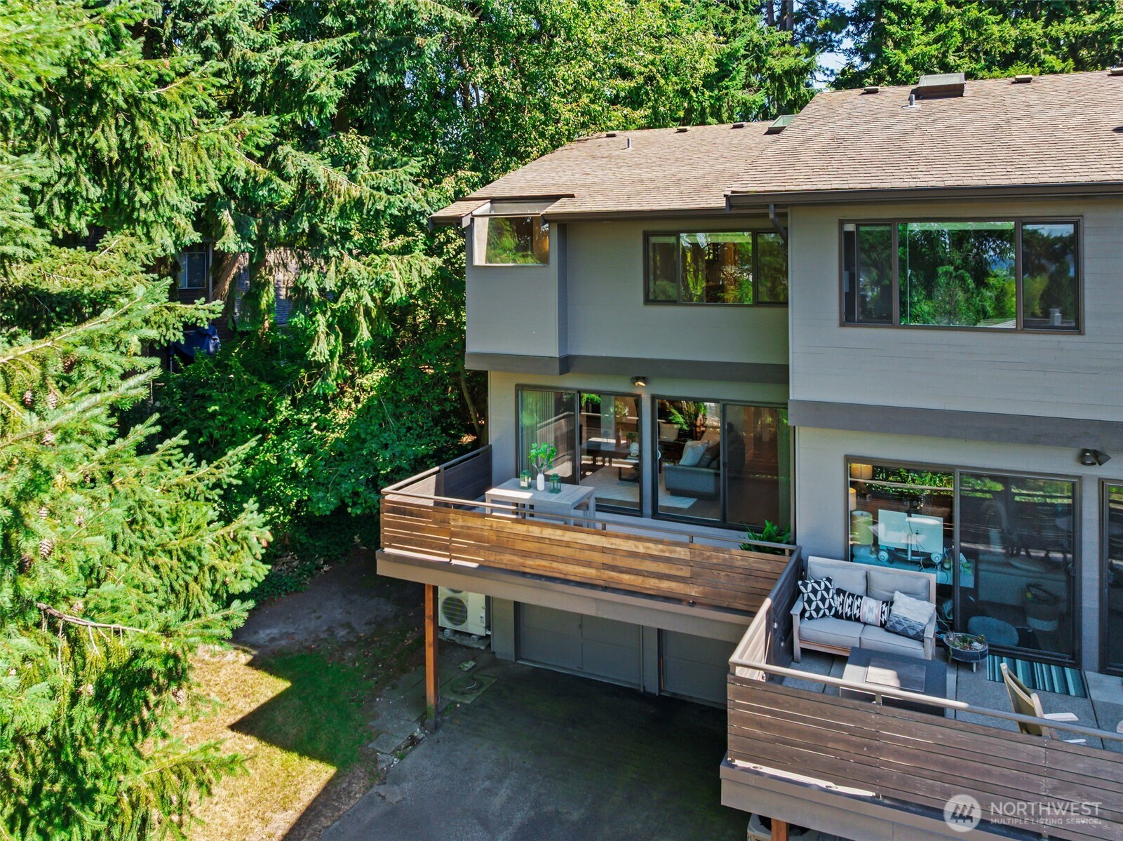 Rear elevation showcasing multiple outdoor living areas and spacious entertaining decks.