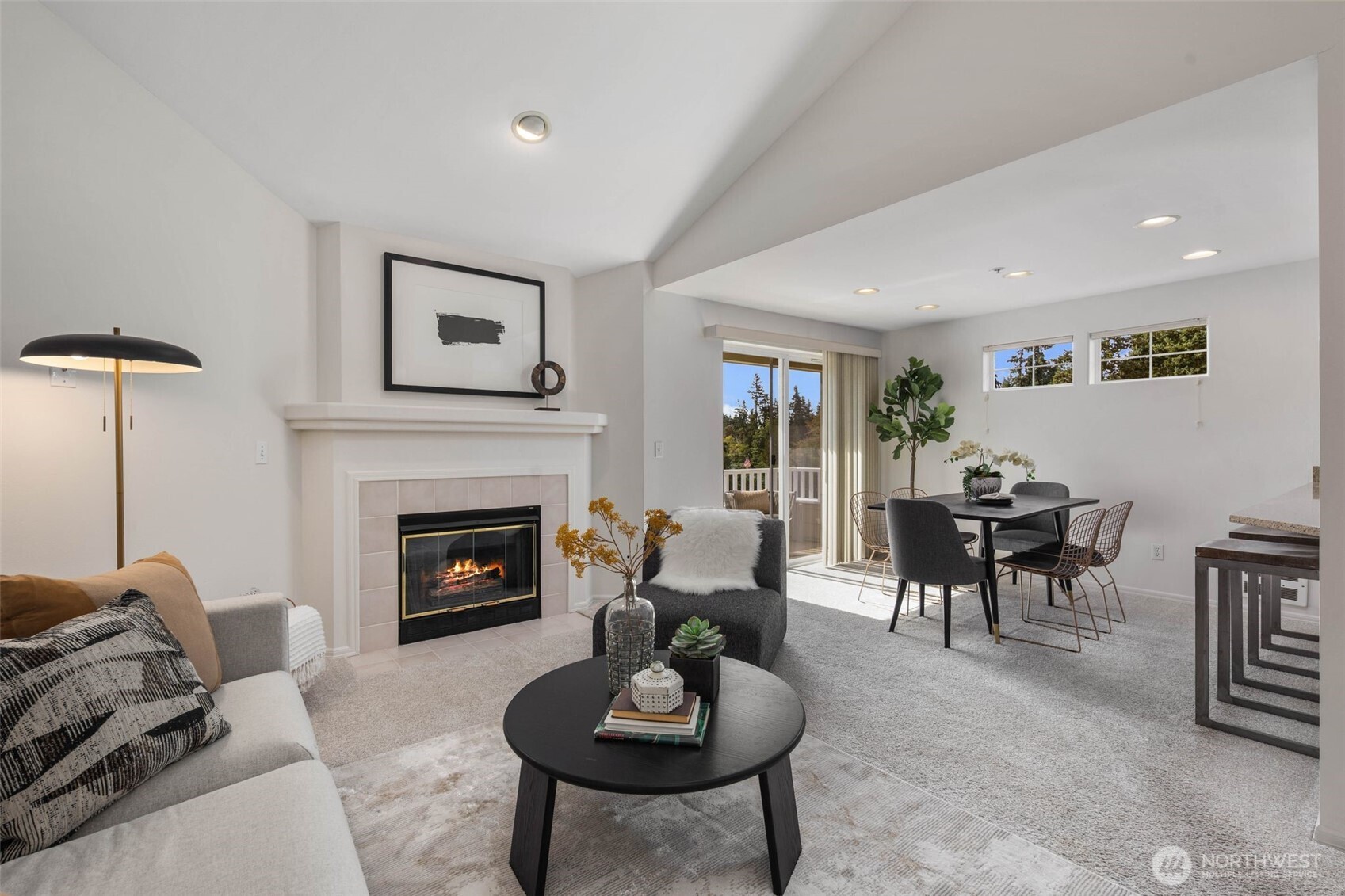 Sought-after top floor corner unit with territorial views in a quiet 10-unit 55+ community. This light-filled home offers an open floor plan with vaulted ceilings, cozy gas fireplace, and private sundeck. The chef’s kitchen features quartz counters, stainless appliances, and ample storage. Recent upgrades include fresh interior paint and wide-plank LVP flooring, creating a modern, move-in ready feel. The primary suite includes a spacious bath, while a large second bedroom and bathroom add flexibility. Secure garage parking for two cars, a storage unit, and elevator access provide convenience. Low HOA dues, well-maintained grounds, and easy access to bus lines, shops, parks, and freeway. Pre-inspected, turn-key, and a must-see!