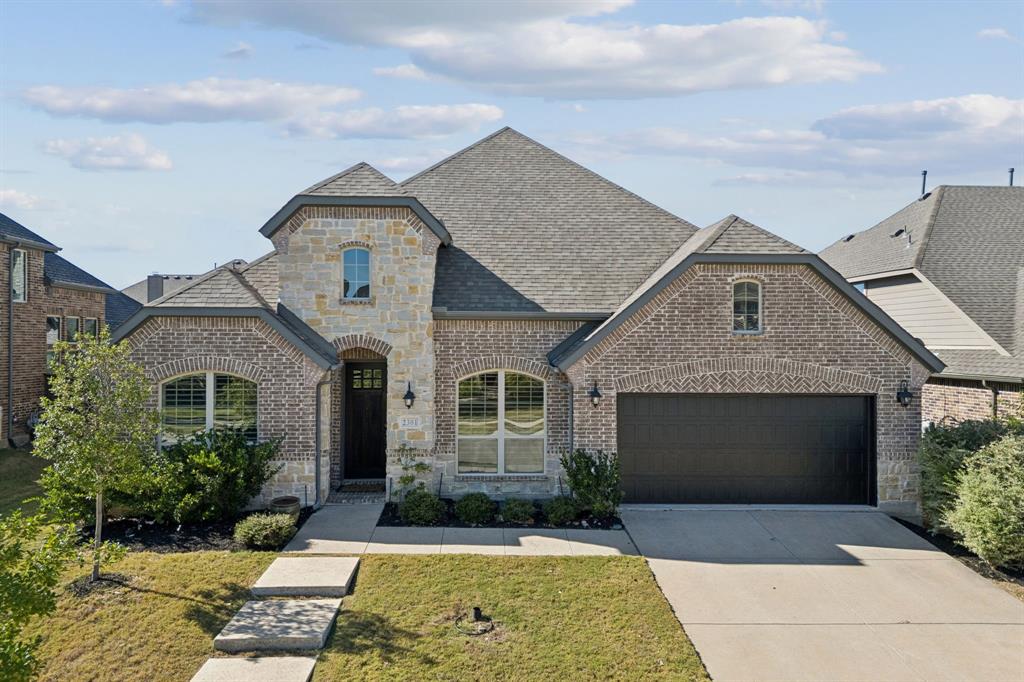 This American Legend one-story home with heated salt-water pool in Prosper ISD sits on a east-facing lot with a three-car garage! Featuring an open living area with hand-scrapped hardwood floors, an abundance of natural light thanks to the floor-to-ceiling windows, 12 foot+ ceilings, arched doorways, new carpet, + plantation shutters. The backyard upgrades include a travertine patio, soft easy-to-maintain turf, Eagleston Holly trees that stay green year-round for privacy. French doors, picture windows, + sliders are by Pella Windows. Heated salt-water gunite pool has a large tanning ledge as well as seating around the edges. Blower jets in the sides of the pool so it can also be used as a spa. Kitchen is great for entertaining with a large center island. The 5-burner gas range stove, Blanco silgranit sink, Kitchen Aid dishwasher, granite countertops, pots + pan drawers, + walk-in pantry really set the kitchen apart. Primary suite has a relaxing view of the back yard + features soaker tub, separate shower, a spacious walk-in closet. Laundry room can be accessed from the primary suite as well, so convenient! Study with french doors can be used for a home gym, play room, study area, craft space, whatever makes sense to make the home right for your changing needs. The media room is a great place to tuck away from the main open living area. Dining room could also be used as sitting area if a formal dining isn’t for you. A secondary bedroom with private ensuite bath + walk-in closet is tucked away + is great for a private guest room or mother-in-law space. 2 other secondary bedrooms share a hall bath. Tandem 3-car garage has a new garage door + built-in shelving. Expansive attic space. In the hall to the garage from the foyer is a large mud bench + coat closet for an easy drop zone. Community amenities such as pools, soccer field, gyms, parks, + playgrounds. Convenient access to major thoroughfares + proximity to the vibrant PGA District! Video in the virtual tour links