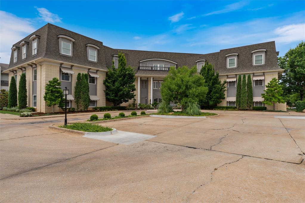 On Grand park. Gorgeous and excellent condition. This unit has been converted to the ADA standards. Wood floors throughout. Large living overlooking patio and Grand Park.  Grand Park, with its miles of walking paths, is at your door step. Nichols Hills Plaza and its wonderful shops and stores is a few steps away.  Only 11 units in this building which is very quiet and secure.  One central entry into the building is monitored with security system and cameras.