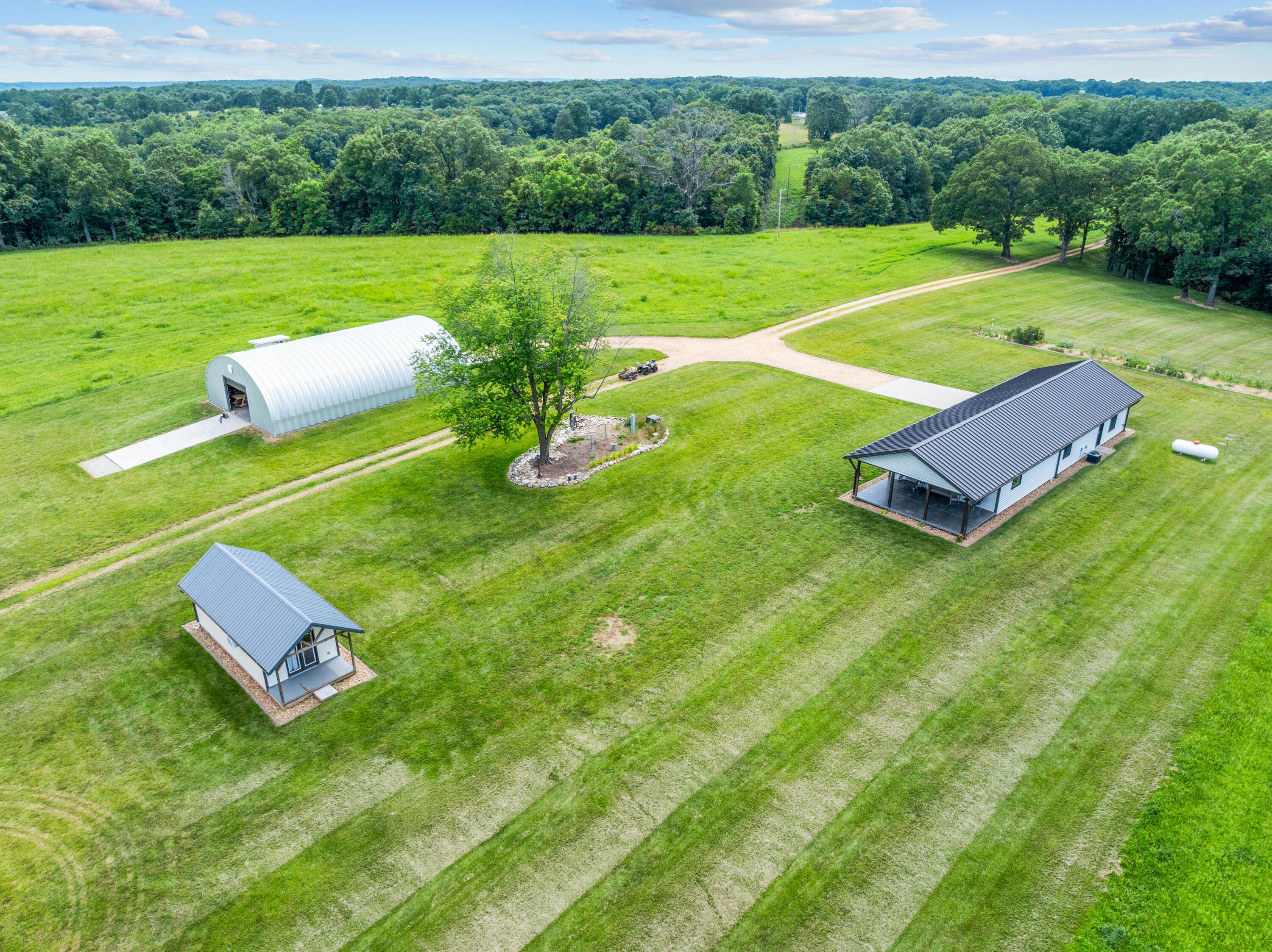Income, Privacy, Serenity & Comfort -- All on 618 Acres in Stone/Barry Counties!Discover an exceptional property that blends income opportunity, recreational enjoyment, and sustainable living. This 618-acre farm offers a rare combination of hay production, timber potential, and premier hunting grounds -- all with unmatched privacy and serenity.&#10024; Key Features:Income Potential: Established hay production with additional opportunity for timber income.Recreational Paradise: Prime habitat for deer and turkey hunting -- easily developed into a private hunt reserve.Chemical-Free Legacy: No glyphosate used on the farm for at least 35 years (verifiable).Workshop/Barn: A metal arched workshop, fully insulated with sprayed-on closed-cell foam, easily convertible into a barn.RV & Equipment Ready: Three 50-amp charging stations for RVs or power equipment.&#127969; The Home:Highly energy-efficient construction with sprayed-on open cell foam insulation.Thoughtfully designed with no vents, tubes, or penetrations through the roof, eliminating leak risk.Radiant floor heating via tankless water heater.Home has filtered water everywhere.Home conducts complete filtered air exchange every 15 minutes via Energy Recovery Ventilator System.Built to maximize comfort, efficiency, and long-term durability.Guest house comfortably sleeps six.This is more than just a property -- it's a self-sufficient retreat with a proven record of productivity, eco-conscious stewardship, and endless potential.