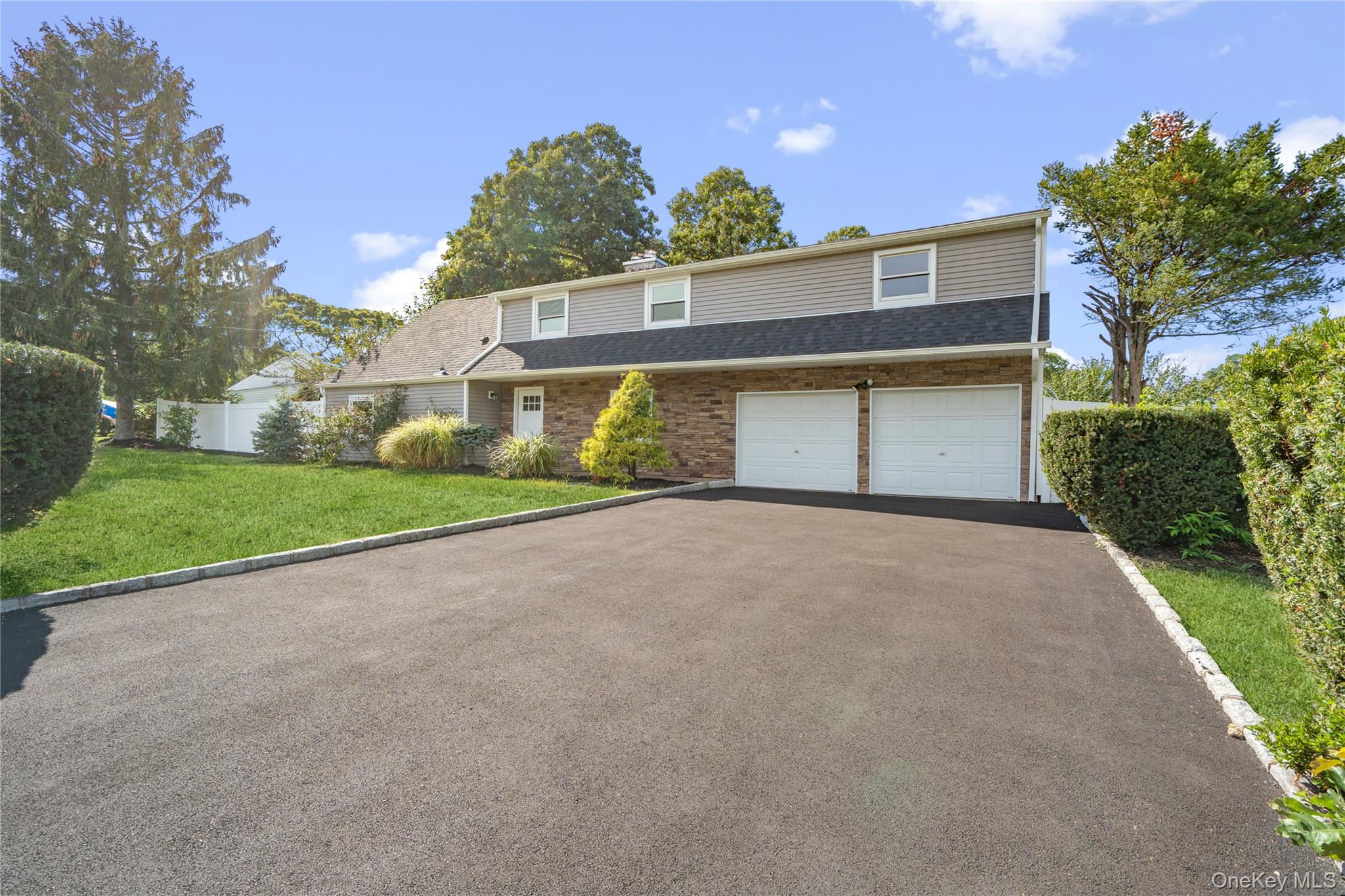 Stunning Colonial in the heart of Selden Oaks. Completely redesigned and fully renovated, this home features 5 large bedrooms, 3 full bathrooms, a den, living room, dining room, and a beautifully updated kitchen with all new appliances and island for extra seating. Additional highlights include a two-car garage, abundant closet space, and a versatile loft/bonus area. Brand new upgrades include a new roof, siding, windows, brand-new AC and heating split units, new plumbing and electrical, new driveway, paver walk-way and Belgium-block border detail. Set on an oversized lot, this home is filled with natural light and offers a bright, spacious layout ideal for both everyday living and entertaining.