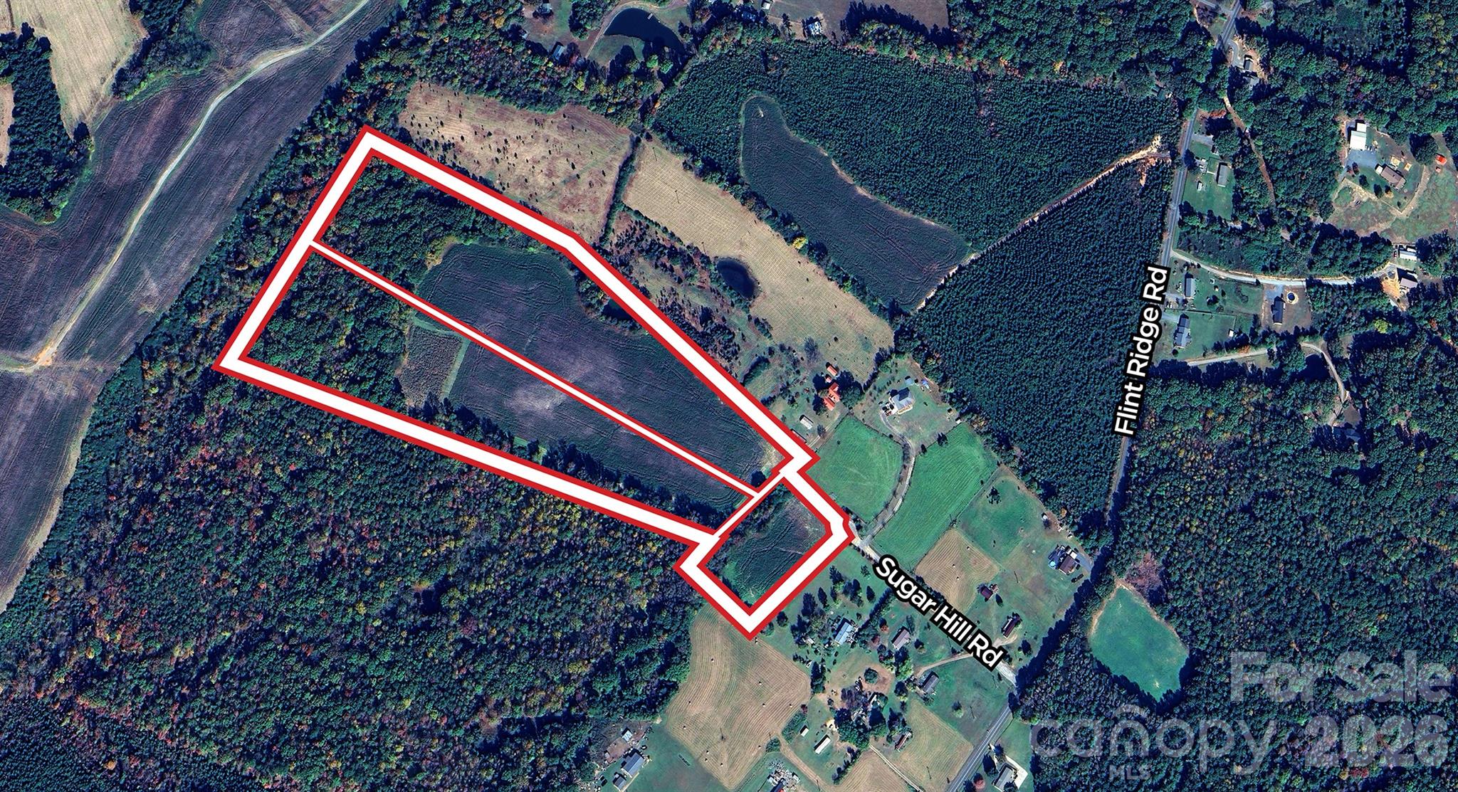 Picturesque 31.2 acre tract of land located in a quiet rural setting, with open land at the front and mature trees along the rear. Excellent choice to build your dream home in the country, or start your hobby farm.  Enjoy the beauty this scenic tract provides. Tract is made up of 3 lots, the smaller lot is 2.59 acres and has Tax parcel #650801170896. The 14 acre lot (Parcel#650801083733) and 14.6 acre lot (Parcel #650801081461) each have a septic permit for a 4 BR home. The 14 ac tract contains a small pond which is shared with adjoining neighbor.    Land is currently in the Agricultural program. There is also a 30' access easement for adjoining property owner through a portion of this land.  Sugar Hill Drive, also labeled as Road and Lane, is a private drive with a 45 ft public RW off Flint Ridge Rd.  NOTE: OWNERS WILLING TO SELL THE 14 ACRE AND 14.6 ACRE TRACT SEPARATELY BASED ON $19,000/ACRE.