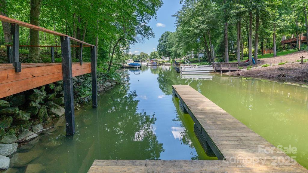 Here's your chance to build your DREAM HOUSE on Lake Norman! Almost 2 acres, with 619sq. ft. of shoreline, private pier that has been dredged, floating dock, no HOA & on a private tranquil cove. Build now or in the future, bring your own builder. The square footage minimum is only 1,000 sq ft for a single-story structure per the attached deed restrictions. Modulas are ok but NO mobile homes per ther revised deed restrictions. Lake Norman levels do vary depending on the season. This large lot with is a fabulous opportunity to live your dream on Lake Norman!