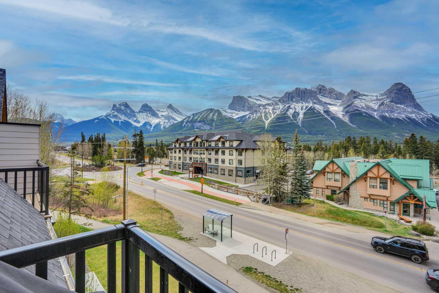 Amazing 180 degree unobstructed SW views that showcase all of the best mountains in the Bow Valley including the Three Sisters, Ha-Ling, the whole of the Rundle Range and Cascade mountain beside Banff. Enjoy watching the sun set over Mt. Rundle from your warm SW facing patio, from two of the downstairs bedrooms and from the whole of the upper level through the expansive windows.  This property had a very strong $162k in gross deposit income in 2025! The condo fees and property tax are low relative to other 3 bedrooms. The combination of strong income, low expenses and lower purchase price relative to most 3 bedrooms in Canmore make this a very favourable investment relative to other short-term rental properties currently available! The 2 floor layout with vaulted ceilings in the upper level is popular for guests with great separation between the upper and lower levels and often gets more revenue than a single level unit. The property has been well maintained and still has a new feeling with many new construction features one is accustomed to including quartz countertops, fireplace and contemporary and well matched decor. The current arrangement allows for sleeping up to 10 guests. Owners can enjoy the outdoor tub for relaxation and the pool is very popular with the kids.The condo is an easy stroll from the heart of downtown Canmore and Spring Creek is just steps away. The price is $1,248,000+GST (GST if often deferred and not paid at the time of sale). This is a fantastic opportunity both to use the property for personal enjoyment and to generate strong income on Airbnb!