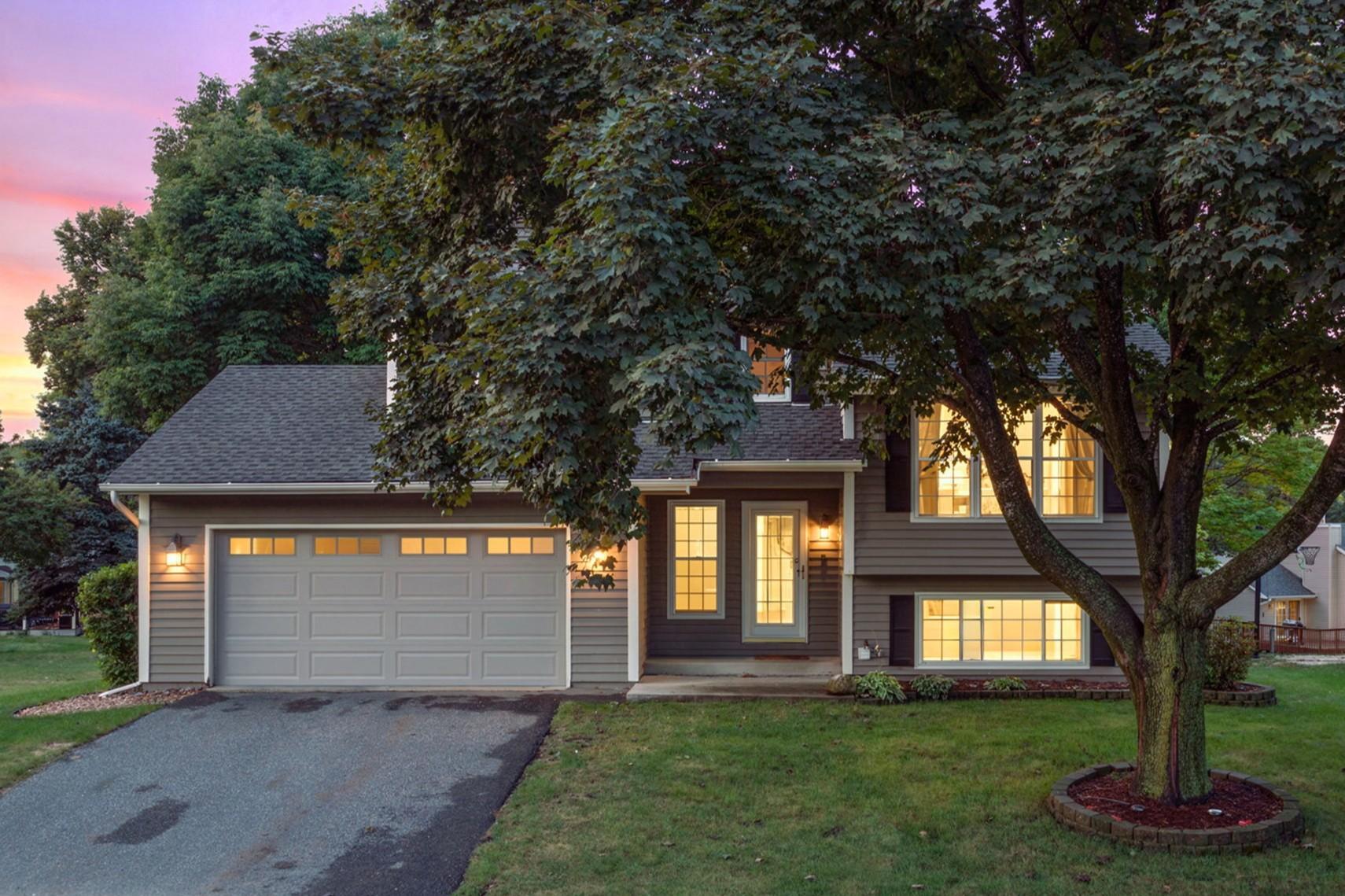 Fresh, beautifully updated, and set in a location that makes everyday living easy within Minnetonka School District!Just down the street from North Lotus Lake Park and minutes from Lotus Lake, downtown Chanhassen, and Excelsior, this home pairs an incredibly convenient setting with a backyard that opens to mature trees and uninterrupted greenspace.Inside, extensive cosmetic and functional updates bring a clean, current feel throughout, including new LVP flooring, LED lighting, electrical outlets and switches, and a completely remodeled kitchen (2025) with new appliances (2026).Vaulted ceilings add volume to the main living spaces, while four bedrooms, multiple living areas, and flexible lower-level spaces offer room to spread out.Outside, a spacious paver patio and maintenance-free deck create a private-feeling setting for relaxing or entertaining.With a new roof, furnace and AC, re-lined main drain, attached two-car garage, and abundant storage, this one is truly move-in ready!
