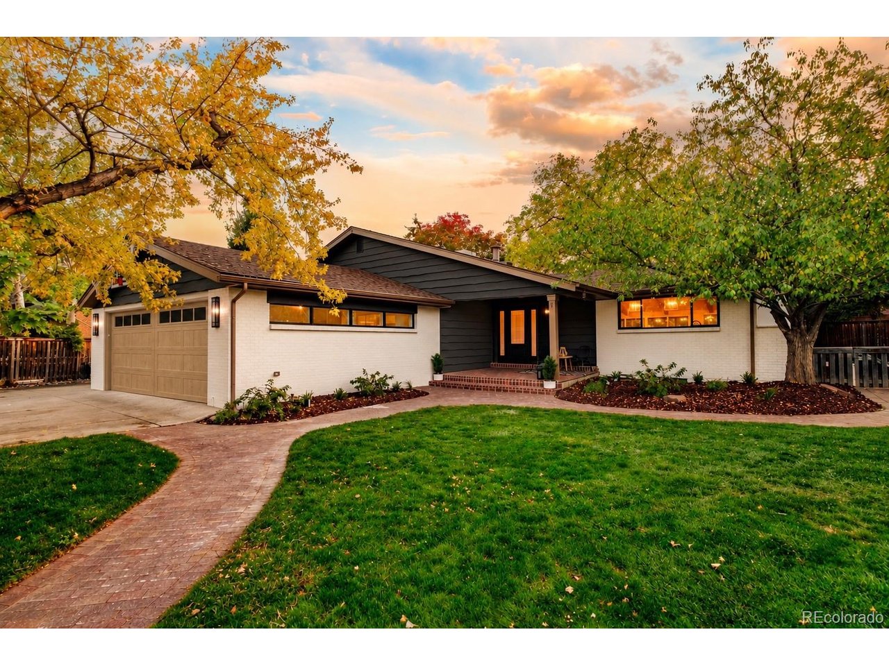 A rare opportunity in the heart of Applewood, this extraordinary residence has been reimagined from top to bottom, blending timeless architectural charm with sophisticated modern luxury. Exceptional curb appeal and a beautiful front entry set the tone for the stunning interiors within. Bathed in natural light, the main level showcases vaulted ceilings with exposed beams, a striking gas fireplace, and beautifully appointed living and dining spaces. The showstopping gourmet kitchen features premium finishes, an expansive statement island, and seamless access to the covered patio, perfect for indoor-outdoor entertaining. The luxurious primary suite offers a private retreat with a spa-inspired bathroom and custom closet built-ins. Upstairs, two generously sized bedrooms share a renovated bathroom featuring a double vanity and designer tilework. The expansive lower level and finished basement provide exceptional versatility, featuring an inviting family room with a custom wet bar, a spacious guest bedroom, a three-quarter bathroom, a dedicated flex room, an expansive entertainment area, and an additional beautifully appointed bathroom. Situated on an impressive one-third-acre lot, the meticulously designed backyard is a true outdoor sanctuary. Offering exceptional privacy, this entertainer's retreat features premium stone pavers, a custom-built covered structure with electricity, an inviting gas fireplace, and lush, mature landscaping-a rare combination of sophistication and tranquility. Nestled in one of Applewood's most desirable neighborhoods, this exceptional home is just moments from Taft and Maple Grove parks, Applewood Golf Course, Clear Creek Crossing, scenic trails, dining, and shopping. With convenient access to Golden, Denver, and the foothills, the location perfectly complements this remarkable property. An extraordinary blend of architectural character, impeccable craftsmanship, modern luxury, and exceptional outdoor living-Applewood living at its finest.