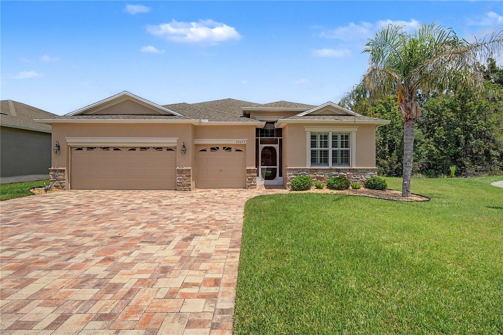 WOW! WOW! WOW!  Where can you find LOCATION, on a Premium Pond and Conservation lot in a Cul-de-sac of a GATED 55+ Community, in PRISTINE CONDITION, with over $140,000 in UPGRADED Features, that is MOVE IN READY and Priced to Sell? This home HAS IT ALL!  Great curb appeal as you drive up to this Stunning ONE OWNER, Custom built 4 bedroom, 3 full bath Home with 3 CAR GARAGE, PAVER DRIVEWAY and walkway, Screened front entry, Stackstone Accents and Leaded Glass entry door to welcome you in!  Once inside, notice the attention to detail in every room! Hardwood floors in common areas, Ceramic tile in wet areas, Light, Bright and OPEN, this Kennedy floorplan is sure to impress! Guest quarters with full bath on a private wing situated at the front of the home. Formal dining area can also be FLEX space as a den or sitting area. 3 way split plan has secondary bedrooms and full bath on rear of one side of the home with one bedroom set up as a home office with built in desks, storage and closet  organized file cabinets. Primary suite is located on the opposite side of the home with Pond and conservation views! Luxurious bath ensuite is spacious with LARGE updated shower, serene palette boasting vanity area, dual sinks, generous storage, custom mirrors & lighting and separate water closet. Walk in CUSTOM organized closet is amazing! Great room is in the Center of the home with built in storage cabinets and entertainment unit. The kitchen is the HUB of the home showcasing Maple cabinets with crown, granite counters & center island, breakfast bar, eat in dinette space, tile and glass backsplash, undermount lighting and updated stainless appliances!  Extra can lights added in the ceiling for a bright space. Screened lanai off the great room is under roof and offers peaceful views of the pond and conservation with birds, fish, turtles and cranes to observe with a sunset landscape view. Located in Tampa Bay Golf and Country Club, this home is the PERFECT PLACE to enjoy the Florida Lifestyle! Championship Golf Course, Tennis and pickleball courts, Fitness center, Billiards room, Poker tables, card and game rooms, Resort style swimming pool, clubhouse with full service restaurant and pub/grille, banquet facilities with dance floor, adult only freeform pool, bingo, library, onsite entertainment and travel excursions for residents!  CALL TODAY to see why this IS the place to BE!