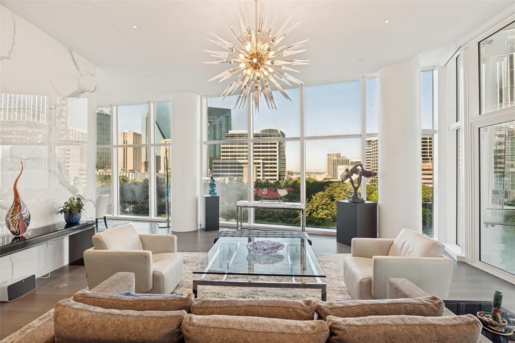 A sophisticated collaboration between renowned designer Penny Drue Baird, Hudson Construction, and Ten + Three, this exceptional residence offers a rare combination of refined design, craftsmanship, and effortless luxury. Perched above the treetops with captivating views of Klyde Warren Park, the Nasher Sculpture Center, and the downtown Dallas skyline, the home is distinguished by timeless interiors that are both striking and understated.Dramatic penthouse-height ceilings create an impressive sense of scale, while a custom Bulthaup kitchen serves as the architectural centerpiece of the residence. Thoughtfully curated finishes and furnishings feature selections from Kelly Wearstler, Élitis France, Sacco, Holland & Sherry, Stark, Poliform, and Phillip Jeffries.Dual primary suites offer exceptional privacy and comfort, complemented by abundant storage, two primary water closets, a private sitting area, and fully customized Poliform closets. A sophisticated dry bar, Sky Room, and elegant powder bath complete the residence, creating memorable spaces for both intimate living and gracious entertaining. Impeccably finished and completely turnkey, this one-of-a-kind home presents a rare opportunity for elevated living in the heart of Dallas.