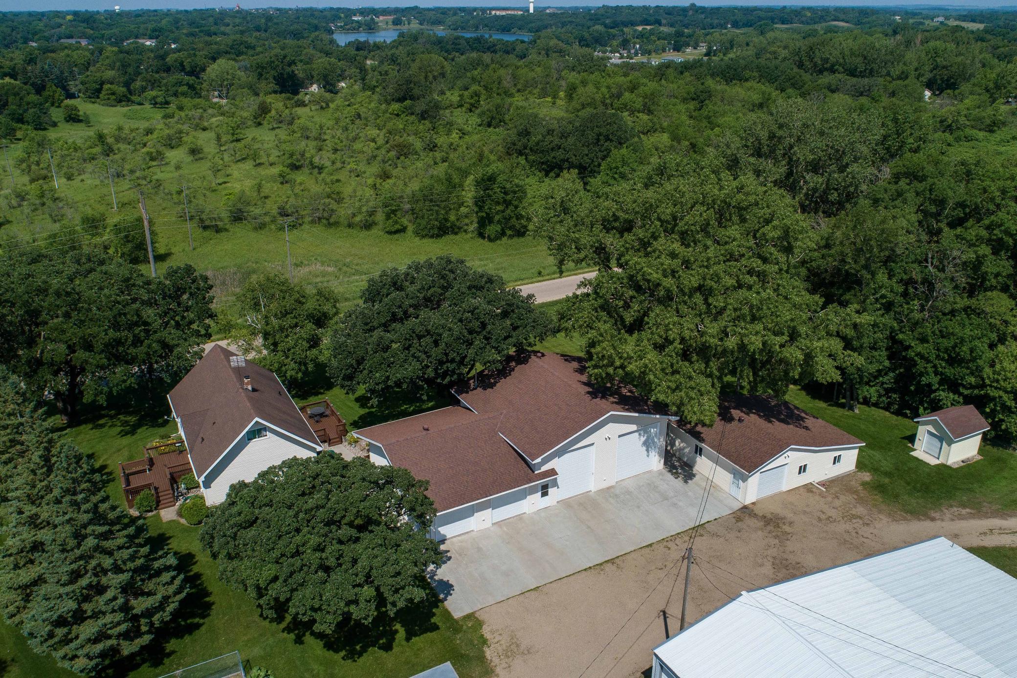 Welcome to this well-maintained 4-bedroom, 2-bathroom home with workshop paradise nestled on 1.37 acres on the edge of Fergus Falls. Offering the perfect blend of comfort, functionality, and outdoor space, this property is ideal for those seeking both peaceful living and a well-equipped shop setup.  Inside, you’ll find a warm and welcoming main level featuring a bright living room with a large picture window and wall A/C, a galley kitchen with oak cabinetry, and an informal dining area conveniently combined with the kitchen. Two bedrooms and a full bathroom complete the main floor. Upstairs includes two additional bedrooms and a spacious storage room.  The lower level boasts a large family room, 3/4 bathroom, laundry room with utility sink and large countertop, a bonus/exercise room, an additional storage/bonus room with computer hookups, and even a second kitchen with a walkout — ideal for entertaining or potential separate living quarters.  Enjoy added convenience with a reverse osmosis system at the kitchen sink, whole-house water filter, Kinetico water softener, and efficient natural gas radiant boiler heat.  Step outside to enjoy two freshly painted decks, low-maintenance vinyl siding and windows, a fenced-in garden, and leaf guards on the gutters of both the house and the shop.  A true standout is the oversized garage/shop — all heated except camper stall, with 3 feet of insulation, epoxy floors, steel wall liners, and 100 AMP electric service.  Features include:  main garage (26' x 36') featuring 2 stalls with epoxy floor coating, Liftmaster openers, air compressor service to all stalls, third stall (20' x 36') with hoist, fourth stall (16' x 36') ideal for camper storage, complete with plug-in and oversized door, fifth stall (28' x 22') set up as a carpentry shop, with an attached 28' x 13' lean-to wood shop, and a separate 10' x 12' garden shed for additional storage.  Do you have a boat, pontoon, ATV, or any other seasonal items you need to store?  Or if you don't need all of the shop space, rent out a couple of the stalls to people looking for storage space - what a great way to assist in paying the mortgage!  So many options!  Don't miss the opportunity to own this well-maintained, multi-functional property with extensive updates and features throughout.  See the list of updates in Documents for full details.