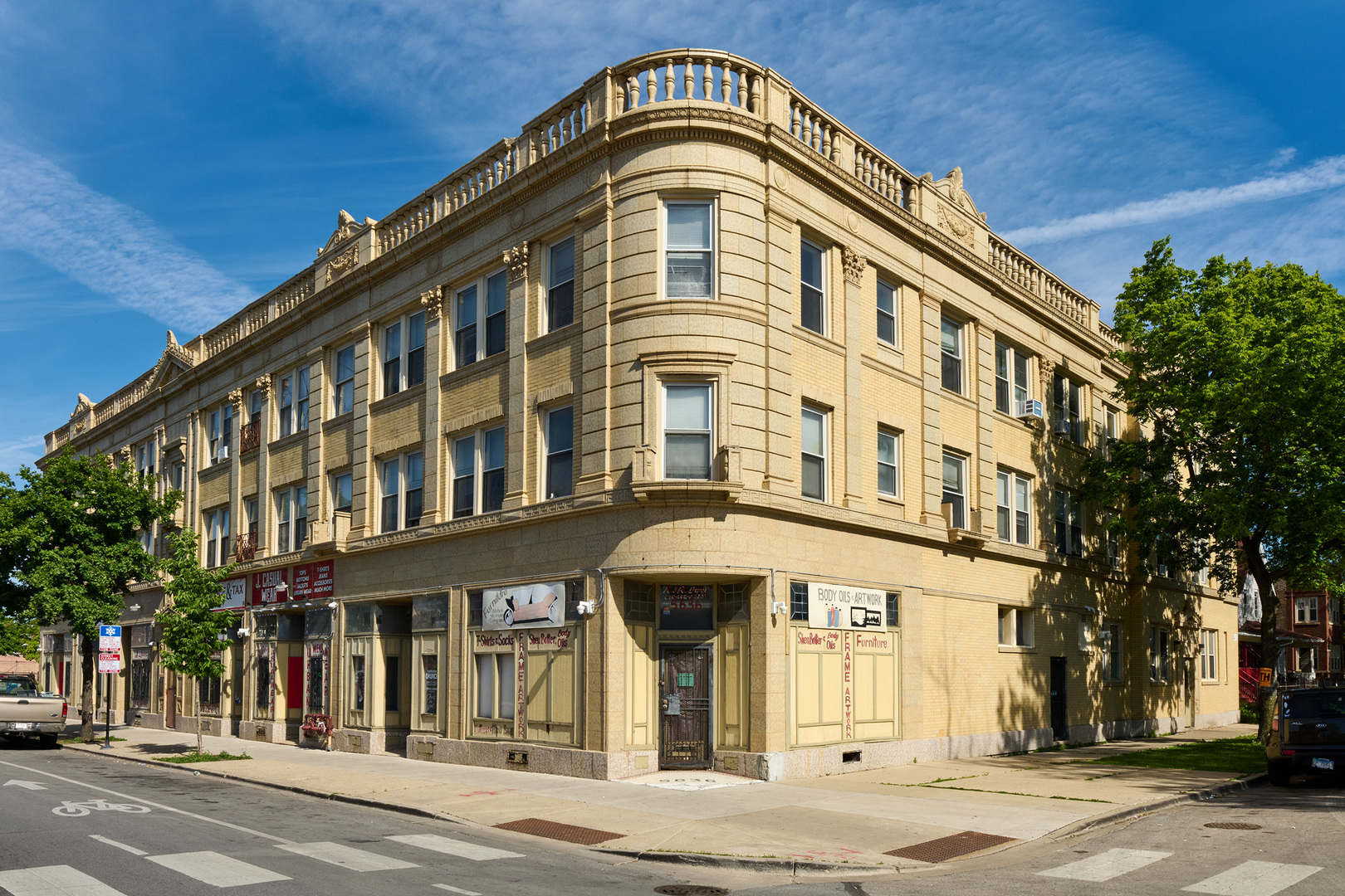 This 33-unit mixed-use property, a bank-owned asset in Chicago's thriving North Austin neighborhood, presents an attractive investment opportunity in a historic urban setting. Constructed in 1925, the elegant terracotta building features 7 commercial storefronts, 20 one-bedroom/one-bathroom apartments, and 6 two-bedroom/one-bathroom apartments, creating a diverse and stable revenue stream. The property's varied unit mix appeals to a wide range of tenants, from small businesses to residential renters. Significant value-add potential exists through targeted upgrades, including modernizing the commercial spaces (notably the vacant corner unit), enhancing on-site parking, and improving laundry facilities. With strategic renovations and efficient property management, investors can unlock substantial cash flow and long-term appreciation in Chicago's dynamic rental market. Located in a vibrant, historic community with strong demand, this property is ideal for those looking to capitalize on the city's growing real estate opportunities.
