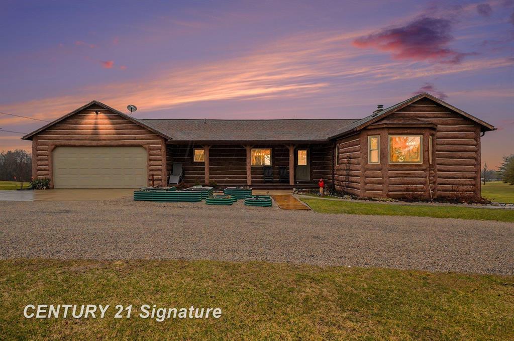 Beautiful, remodeled log home located on one of the highest points in Gladwin County, overlooking the 8th hole of the Gladwin Heights Golf Course. this stunning home features a fully updated kitchen, and thoughtful updates throughout while maintaining its rustic charm. inside, you'll find soaring cathedral ceilings, exposed log beams, and an impressive fieldstone gas fireplace with a hand-carved mantel, creating a warm and inviting living space. step outside to the spacious wraparound deck, perfect for entertaining or relaxing while enjoying the beautiful golf course views with your morning coffee. The property is surrounded by beautiful flowers and fruit trees. A rare opportunity to own a unique log home in a peaceful and scenic setting.    list of updates to the property.   2021 Main bath updated 2021 Lower level bath update 2022 water Heater 2022 Hansons Windows  2022 Furnace 2022 Water Filtration 2022 Air conditioner 2022 Exterior Doors 2022 workshop exterior outlet-RV 2022 Heated Workshop 2022 Garden Shed 2022 lower Level Flooring 2022 kitchen update 2023 Generator 2024 Garage Electric panel 2025 Water Softener system Rebuilt 2025 E-car Power Outlet 2025 Small shed 2025 Orkin pest Shield 2025 Septic Serviced/Pumped in.