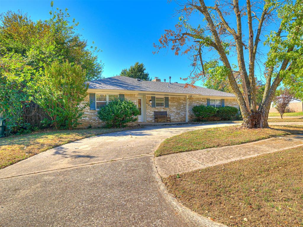 This darling house offers a kitchen with granite countertops with space for a good sized dining table and enjoy the wood, brick burning fireplace.  The living room is tucked away to enjoy company. The primary suite has a shower and the hallway has a bath/tub combo.  The hallway offers many built in cabinets for storage. The huge backyard offers a large patio and a wooden privacy fence. The 2 car garage has a lot of space and has 2 ways to get to the backyard. The driveway and circle drive makes it easy to have many guests. The property is approximate 1-1.5 miles to the university.  There are many restaurants in that area. The white refrigerator stays with the house. Buyer to confirm schools.