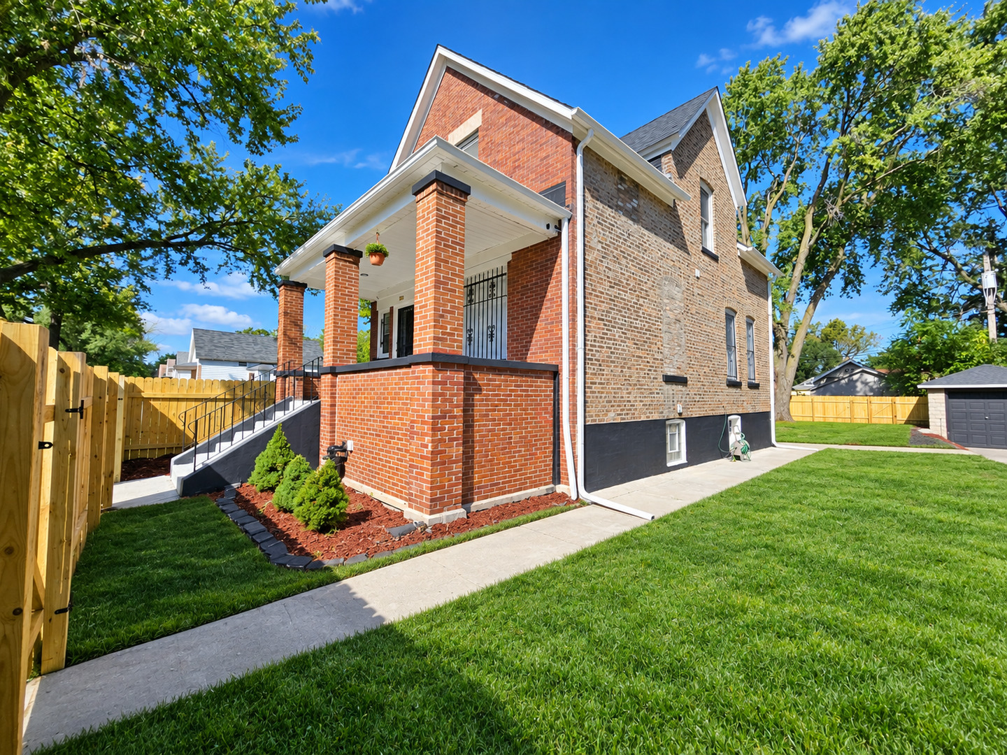 Welcome to your dream home! This spectacular 4 bedroom and 2.5 bathroom brick bungalow rehabbed home is situated on a large double lot in a charming tree lined street. A rare find, featuring tons of space, high ceilings, plenty of natural light and a breathtaking fireplace in the living room. Gleaming hardwood floors greet you at the entrance as you step into this luxurious home with high-end finishes that features a desired open floor plan layout and a powder room on the main level, perfect when entertaining guests. The elegant gourmet kitchen boasts top of the line brand new stainless steel appliances, white shaker cabinets, designer tile backsplash, gorgeous quartz countertops, extravagant light fixtures and an enormous island with a breakfast bar to enjoy culinary delights with family and friends. The beautiful dining room is next to a picturesque window that showcases the garden adorned with greenery and beautiful trees. The marvelous second level features 3 generously sized bedrooms that offer comfort and ample closet space. Lavish bathrooms showcase elegant design that provide a relaxing oasis. The full finished basement features its own private entrance perfect for related living arrangement offering 1 bedroom, full bath, family room, and a laundry room equipped with a washer and dryer. This exceptional home also offers a driveway with ample space that fits multiple cars and a 1 car garage. New fence surrounds the entire property providing privacy and beauty. The backyard is perfect for enjoying those summer barbecue's and family gatherings. Conveniently located near I-94, I-57 and public transportation.