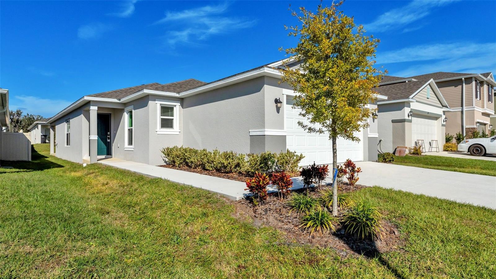 This new build home is now available in the Hickory Ranch neighborhood of Auburndale, FL! Featuring an open floor plan with volume ceilings and tile flooring in main living areas. The kitchen includes a center island, granite counters, and stainless-steel appliances. The primary suite offers a walk-in closet and connecting bath with dual sinks and a walk-in shower. Additional highlights include a dedicated laundry room with garage access, covered back patio, and attached two-car garage. HOA-maintained neighborhood.