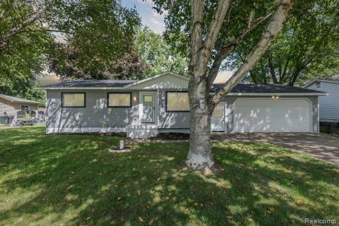 This gorgeous 3-bedroom, 1.5-bathroom home is a true gem! It boasts a spacious sunroom, perfect for enjoying year-round natural light, and a fenced-in backyard with a beautiful pool, ideal for entertaining or relaxing. The home is surrounded by mature trees, offering a tranquil and scenic setting. Inside, you'll find an entirely updated space with refinished hardwood floors, fresh paint throughout, and modern light fixtures. The kitchen is a chef’s dream with new granite countertops, a stylish mosaic backsplash, and plenty of storage. Both bathrooms have been fully renovated with high-end finishes. Major updates include a new roof, siding, central air, furnace, and water heater, ensuring peace of mind for years to come. Additionally, the home features a two-car garage and is located within the highly rated, award-winning Davison School District. This home is move-in ready and offers a perfect blend of comfort, style, and convenience.