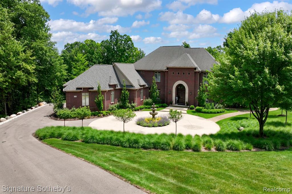 This stunning, 8,000 sq ft fully updated lakefront estate spans 2.6 acres and offers every luxury you could imagine. Positioned on a hilltop, it provides breathtaking views and features a paver path that leads down to the lake. The brand-new 20x40 saltwater infinity pool, complete with pebble tech and an automatic cover, overlooks the water. The home boasts 6 spacious bedrooms, 6 full bathrooms, and 2 half baths. Additional highlights include an elevator, a heated 4+ car garage with an electric charger, and a 6-person, 4-wheel drive vehicle to help you navigate down to the lake. The estate has sandy lakefront access, with a boat house to store water toys. It is equipped with all-new appliances, a natural gas generator, and an elevator that serves all three levels. The 500 sq ft primary suite offers a private sitting porch with stunning lake views. Patios and decks are located on every level, and the lower level includes changing rooms for guests. The home also features a theater room with custom seating. With top-of-the-line amenities and impeccable updates throughout, this estate truly has it all.