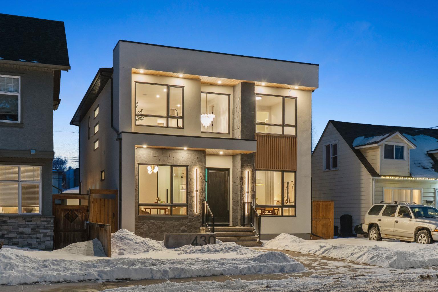 Designed with intention and built with precision, this custom two-storey home in Winston Heights showcases over 3,900 square feet of luxury living where craftsmanship meets modern design. As you enter, the main floor immediately impresses with soaring 10-foot ceilings, open-to-below ceilings, a gorgeous chandelier, wide-plank hardwood, and an abundance of natural light that fills every corner. The front foyer opens into a thoughtfully designed office enclosed by glass walls, with large windows creating a bright and quiet workspace. Just beyond, the formal dining area provides an elegant setting for gatherings, seamlessly connected to a butler's kitchen and full pantry for added storage and prep space. The chef’s kitchen is the centrepiece of the home, featuring Jenn-Air built-in appliances, a 48” 6-burner Jenn-Air stove, an oversized multi-tier quartz island, quartz backsplash, undermount and inside cabinet lighting, and a striking custom range hood. It opens to a spacious living room anchored by a sleek gas fireplace, custom panelled feature wall with wood grid detailing and oversized windows overlooking the deck and backyard. A stylish powder room with custom San Marcopolo Luxury Oro waterproof paint and a large mudroom with built-ins complete the main level. Heading upstairs from the beautiful maple hardwood open riser stairs, a central family room provides a relaxed lounge area with large windows and built-ins separating the bedrooms for added privacy. The primary suite is a retreat of its own, complete with an oversized walk-in closet featuring custom millwork and access to the laundry room. The ensuite is finished to perfection with a freestanding tub, double vanities, a makeup vanity, a steam shower with body jets, and heated floors. Two additional bedrooms offer generous space, each with built-in closets, and share a full bathroom. The fully developed basement extends the living space with a large open recreation room ideal for entertaining, a custom wet bar, a private gym, a full bathroom, and an additional bedroom perfect for guests. Finishes are carried throughout with the same high-quality craftsmanship, lighting, and millwork found upstairs. Outside, the home sits on a landscaped lot with a spacious rear deck and an oversized three-car detached garage offering ample parking and storage. Additional upgrades include rough-ins for built-in interior and exterior speakers, A/C rough-in, and a security system including exterior cameras. The location is exceptional, steps from Winston Golf Club, surrounded by schools, parks, and playgrounds, and just minutes from downtown, and Deerfoot Trail. This home blends refined design, comfort, and convenience in one of Calgary’s most sought-after inner-city communities. Call today to book your private tour.
