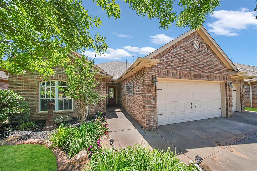 Hard to find 4 bed, 3 full baths & 3 car garage located on private greenbelt lot! WELCOME HOME to gated Kimberly Crossing, situated in the heart of Edmond. The large living room with tall windows provides a view to the beautiful backyard. The kitchen has gas stainless steel range and a large eat in dining space. 4 spacious bedrooms with a split 2 and 2 plan gives everyone their own space. One of the secondary rooms has it's own ensuite! The primary bedroom has patio access, huge Australian wrap around closet, whirlpool tub, shower, and lots of storage. The backyard backs to the wooded greenbelt with complete privacy. The patio has been extended and covered to accommodate plenty of seating for entertaining. A plumbed in gas grill stays and electric was added for your outdoor kitchen/bar set up. Outlets added to soffit for patio lighting. Storm shelter is located in the large 3 car garage floor. Home has sprinkler system, a newer fence, upgraded gutters along with new flooring. Seller is leaving behind the very nice refrigerator in the kitchen AND the one in garage. Washer/Dryer and some other neat things remain as well!