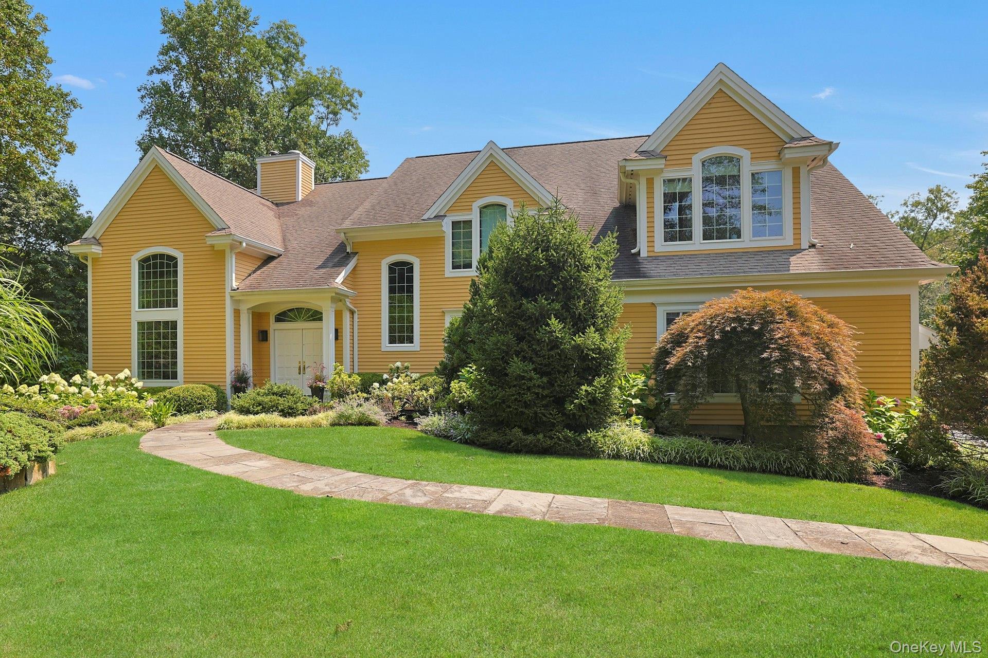 Welcome home to this custom-built, meticulously maintained four-bedroom colonial, hitting the market for the first time by original owner. Set back on over 3.5 acres of private land with winter views of Davis Pond, this home features high ceilings, a thoughtful floor plan perfect for entertaining and family living, and a chef’s kitchen with custom-built cabinetry. Step out from the kitchen onto a back deck with serene, scenic views—ideal for nature lovers. The backyard is completely fenced in, offering privacy and security, and the property boasts beautifully landscaped gardens with specimen flowers, hydrangeas, blackberry bushes, and a flourishing vegetable garden. The home also offers flexible office spaces for office / gym and more with great lighting and a walk-out lower level providing additional versatile living space. A charming front tree with a swing adds a whimsical touch to this move-in ready home. Conveniently located near Byram Hills schools, the town of Armonk, and just one hour from New York City via Metro-North.