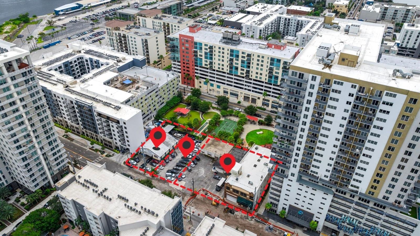 Seize the opportunity to acquire a prime redevelopment site in Tampa’s Channel District. This assemblage consists of three adjacent parcels at 1121, 1125, and 1127 E. Twiggs St., totaling approximately 0.7049 acres. The 30,706 SqFt is the total square footage of the land. Zoned CD-1 (Channel District - Mixed Use) with a Current FAR of 7.0, the property offers flexibility for mixed-use commercial projects. Potential developments include office, retail, hospitality, and hotel ventures, making it an ideal asset for investors aiming to leverage Tampa’s rapid growth. Located next to Madison Street Park and Dog Park, this site offers adjacent green space and a prime position near top attractions like the Tampa Riverwalk, Amalie Arena, Sparkman Wharf, and the Florida Aquarium. Its proximity to the Tampa Convention Center, which hosts over 100 major events annually, amplifies its appeal for hotel and hospitality developments catering to business and leisure travelers. The Tampa Riverwalk, a major draw with over 1.2 million annual visitors, ensures foot traffic and visibility for retail and hospitality businesses. Initiatives such as the Riverwalk Attraction Pass, which saw 12,000 visitors redeem passes in 2023, further bolster the area’s vibrancy. The property benefits from excellent connectivity, with access to major roads such as Channelside Drive, FL-618 (The Selmon Expressway), I-275, and I-4. Public transit is available via the TECO Line Streetcar, linking downtown Tampa with Ybor City. Tampa International Airport, located just a short drive away, is undergoing a $2.5 billion expansion, positioning itself to handle up to 35 million passengers by 2037. The airport's growth enhances the potential for developments catering to both domestic and international travelers. Port Tampa Bay, Florida’s largest port, is located 0.3 miles from the property, handling over 36 million tons of cargo annually. This offers a logistical advantage for large-scale construction projects or businesses reliant on imported materials. Continued investment in the port's expansion will support Tampa’s commercial and industrial growth. Utility services at the site are robust, with power from Tampa Electric, water and sewer services from the City of Tampa, and internet from Spectrum and Frontier Communications, making the site fully equipped for various development possibilities. Tampa’s economy is booming, driven by industries like finance, technology, healthcare, and real estate. Major corporations such as Raymond James Financial, Bloomin’ Brands, and Moffitt Cancer Center are fueling the city’s rapid growth. This environment is attracting investment, with over $1 billion in taxable hotel revenue generated in Hillsborough County in 2023, a 4.82% increase from the previous year. Tourism plays a key role, with 26.7 million visitors contributing $8.5 billion annually and the world renowned beaches of St Pete and Clearwater less than 30 miles away. Tampa is also a top migration destination, with a net gain of 54,000 between July 2022 and July 2023. This influx, driven by affordable living and favorable business conditions, positions Tampa as one of the nation’s fastest-growing regions. With its prime location, flexible zoning, and proximity to key attractions and transportation hubs, this 0.7049-acre site offers exceptional potential for investors looking to shape the future of downtown Tampa.