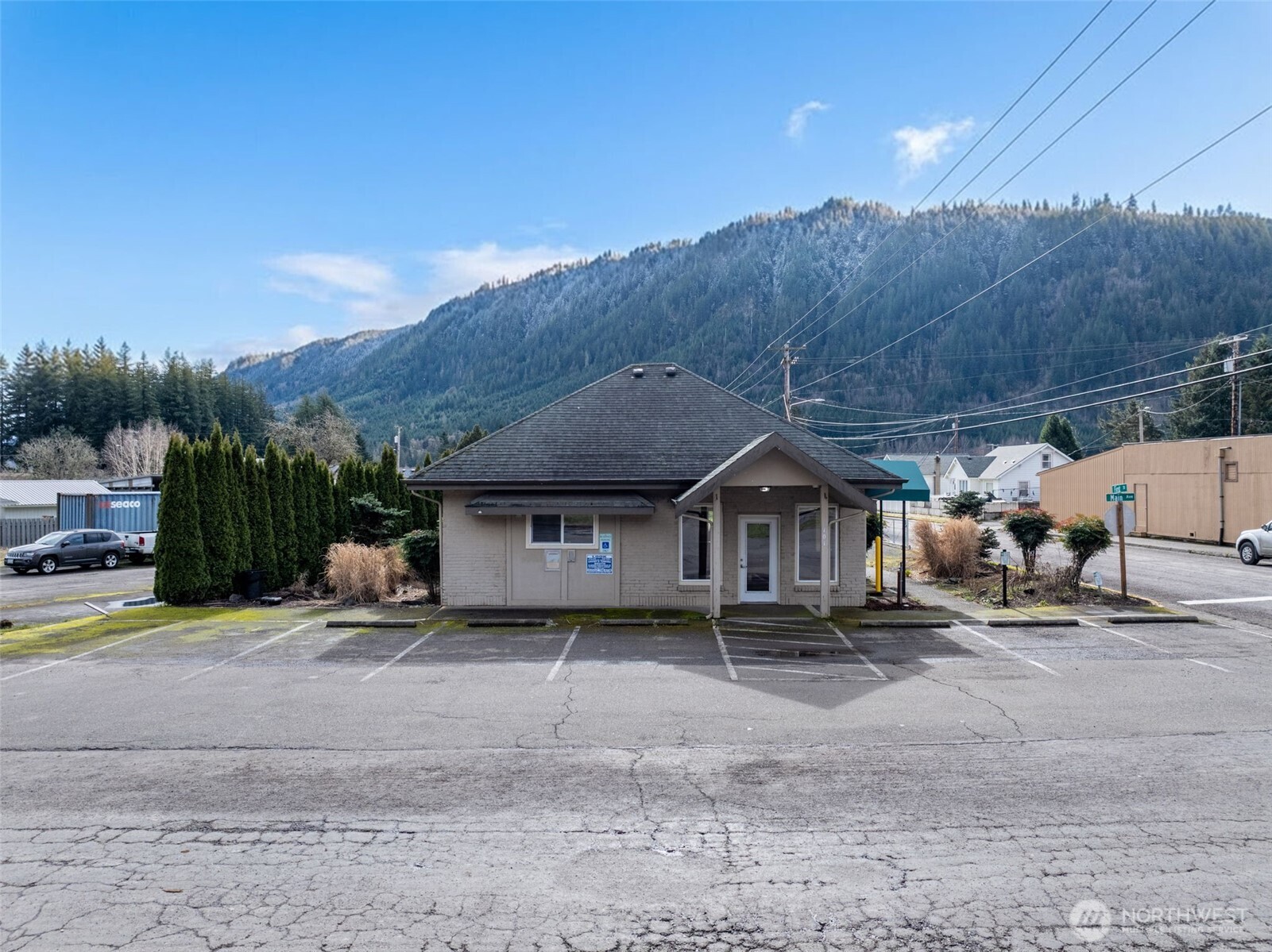 Versatile and well-positioned, this just under 900 sq ft commercial building offers a smart layout that adapts easily to a variety of business uses. The interior features **two spacious private offices**, an **open reception area** ideal for client-facing operations, plus a **kitchen area and bathroom** for everyday convenience. Situated on a highly accessible corner lot, the property provides seven parking spaces in front, with additional room in the back for overflow parking or future flexibility—because no one likes circling the block. With a proven history as a **bank, insurance office, and massage studio**, this building has already shown it can comfortably wear multiple professional hats. Whether you’re launching a new venture or relocating an established business, this location offers visibility, functionality, and adaptability in one tidy package. Whether you're looking to move your current business or you're just getting started, this one could be exactly what you've been looking for.