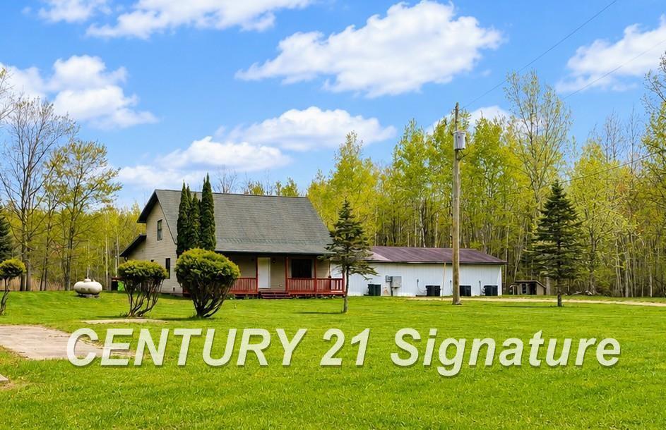 Discover the perfect blend of privacy and versatility on this sprawling 20-acre Beaverton estate. This unique offering consists of two parcels of land being sold together, encompassing four separate addresses-providing incredible flexibility for future development, investment, or a family compound. The main residence welcomes you with a stunning open-concept Great Room, featuring towering vaulted wood ceilings and an expansive layout designed for both relaxation and large-scale entertaining. Best of all, this homes comes fully furnished-making it a truly turn-key opportunity! Enjoy morning coffee on the massive multi-tiered deck overlooking your own serene, tree-lined pond-complete with a paddleboat and picturesque views. The property is well-equipped for functionality, featuring a dedicated electricity meters and septic system. The grounds also include a secondary residence, ideal for guests or rental income, plus a professionally spray-foamed insulated workshop for all your gear and hobbies. Whether you're looking for a peaceful northern Michigan escape or a multi-generational homestead, this 20-acre oasis offers unmatched potential. Schedule your showing today and see the possibilities for yourself.