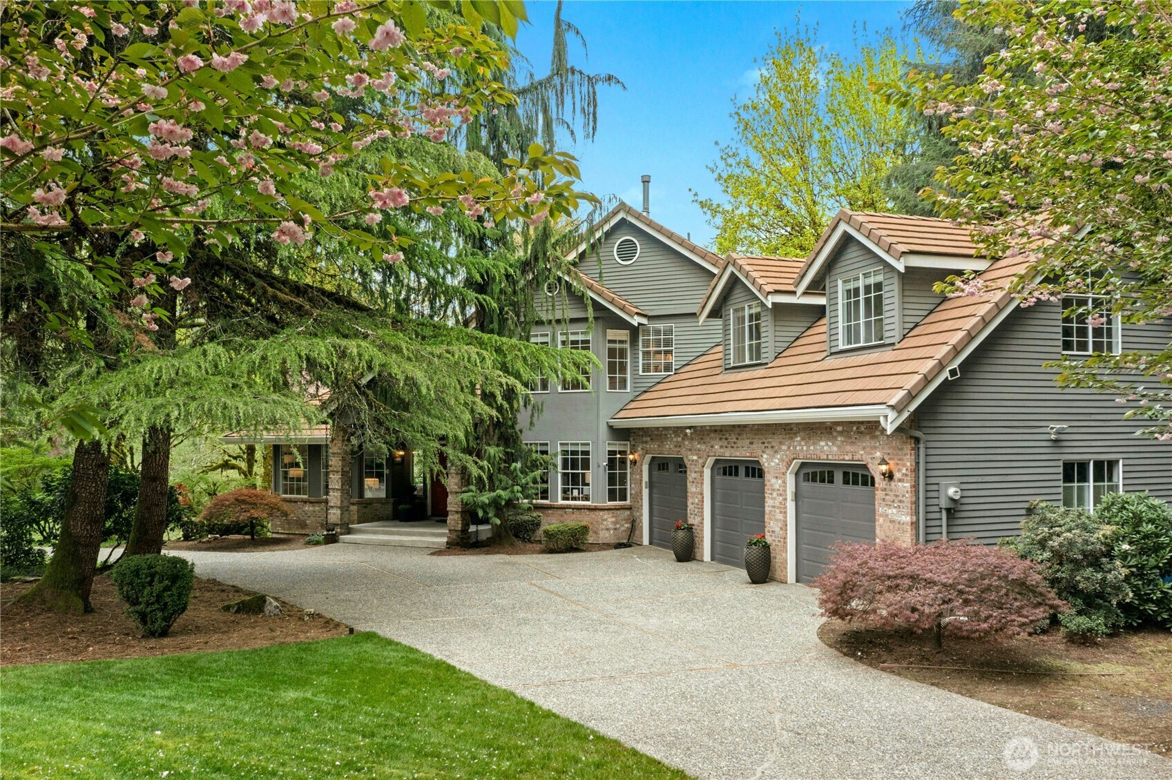 Secluded Issaquah Creek Waterfront Estate located in Four Creeks Ranch.  Grand circular drive welcomes through a lush and mature landscape to this 1.4 acre private residence.  A large covered front portico greets to this 4,460 sf beautiful home and stunning setting with an approximate 111' feet of creek frontage.  Enjoy scenic views of Issaquah Creek from key oriented living areas of the home.  An amazing floor plan with spaces for everything and everyone.  Highlights include a view-nook centerpiece with massive picture window soaking in nature's views.  Entertain with ease, a fully equipped professional theatre, a game/party room with bar, vaulted ceilings, 3 fireplaces, and nearly 1,000 sf of outdoor living areas with layered decks.  The primary suite through double doors features a resurfaced private view deck of it all.  A secondary back staircase leads to the bonus room connecting upstairs bedrooms.  Additional upgrades include an outdoor accent lighting system and indoor Lutron lighting, newer garage doors at the 3-car garage with workshop, wired for EV charging and installed generator switchover panel.  Many other upgrades, additional boat/trailer parking and ample storage.