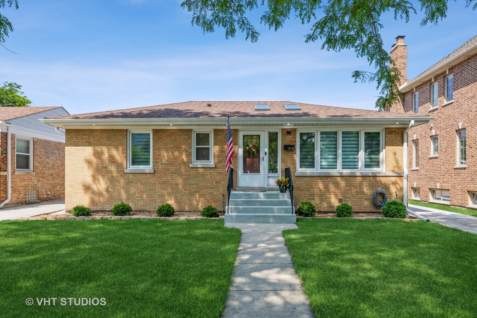 If you are looking for a modern, renovated, and move in ready home in a great area well then this is it!  Welcome to 5942 N. Oriole.  This great home has been beautifully renovated and meticulously maintained over the years.  The first floor features a wide open layout with a big living room with vaulted ceilings and skylights.  The open and bright kitchen is built out with 42" white maple cabinetry, quartz countertops, and stainless steel appliances.  The first floor also has 2 bedrooms, a full remodeled bathroom, dining room, hardwood floors, new doors, new trim, and recessed lighting throughout.  Head downstairs and you'll find a spacious family room, with wet bar, a 3rd bedroom, a 2nd full well appointed bathroom, and laundry room with built in storage.  There is a great built in bar area, room for additional table seating, and plenty of closet storage.  This home is on an extra wide and deep lot and has a side drive, 2 car detached garage, and a great yard.  All the big ticket items have been taken care of over the years.  New roof, new sound proof windows, new doors and trim, fully updated bathrooms, kitchen, flooring, not to mention updated electrical, plumbing, and so much more!
