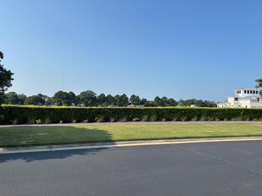 Perfect location, corner lot and blocks to private beach! In a quiet cul de sac, this level and spacious property is flanked with shrubs to the right for privacy and serenity. Get started today on your new home in the amazing golf cart community of Cape Charles! This is a rare NON-Membership required property!