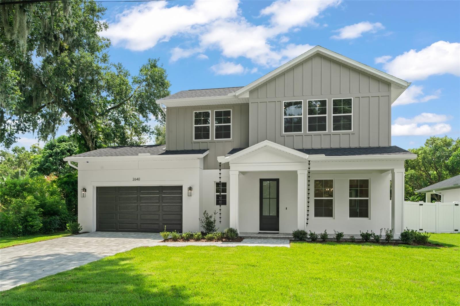 One or more photo(s) has been virtually staged. Welcome to a new custom built Fortis Enterprises masterpiece, offering 3,198 square feet of modern luxury living, conveniently located in SODO.

This 4 bedroom, 4 1/2 bathroom residence includes the primary bedroom and a guest suite on the first floor; a flex space which can be used as a dining room, an office or a den; a butler’s pantry; a mud room, a loft; a large covered lanai; fenced backyard and 2-car garage.  

The board & batten exterior is timeless and welcoming, as is the charm of a front porch.  As you step inside the foyer you notice the beautiful engineered wood floors and the designer selected finishes and fixtures within.  Just ahead and adjacent to the garage entrance is a conveniently located mud room with built in cubbies and bench, here you can stop and drop off items as you enter from the garage.  The utility room is discreetly located off the mud room, it hosts a built utility sink and cabinetry to keep things tidy and organized. 

Stepping into the great room you see the gourmet kitchen, designed to please a Chef.  It showcases Thermador appliances, which include an induction cooktop, a built-in combination oven & microwave, dishwasher and refrigerator.  The vented hood has a custom built surround, complimented by an eye catching backsplash and pendants over the kitchen island.  In addition the kitchen cabinetry, there is a walk-in pantry closet, and a butler’s pantry with a wine refrigerator.  There is a discreetly placed powder bath located off the great room, for visitors and guests.  On the back of the great room is the stacking sliding glass door which takes you to an expansive covered lanai, which has been pre-plumbed for a future summer kitchen.  The rear yard is privacy fenced and has been pre-wired for a future pool, should the owners choose to add one at a later date.

The primary bedroom with en suite bathroom, provides a retreat style ambiance for the owners.  This peaceful space allows them to enjoy an indulgent bubble bath in the large soaker tub or a relaxing a spa-like shower experience.  A place where they can freshen up at the dual sink vanity or enjoy the pleasure of selecting their wardrobe from either the enormous walk-in closet or the second closet within this bedroom.  Finishing out the first floor is bedroom 2, which has a walk in closet and an en suite bathroom.  This highly sought after, but hard to find layout, with both the primary and an additional bedroom on the 1st floor, offers peace of mind for varying stages of life.

A wood staircase with a hearty wood handrail and stunning metal spindles, welcomes you upstairs into the loft.  This thoughtfully designed space has three storage closets, and serves as a secondary living area.  The engineered wood flooring flows through the loft, and into bedrooms 3 and 4.  Bedroom 3 has a walk-in closets as well as a second closet, and shares a full bath with the loft area.  Bedroom 4 hosts a walk-in closet and an en suite bathroom.  All finishes were thoughtfully designed by the decorator.  Finishing out the second floor is the mechanical room with some attic space storage.