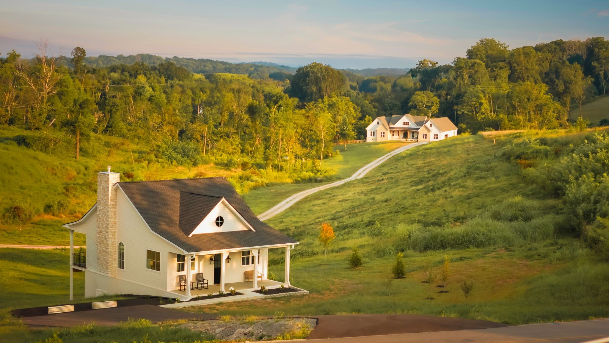 RARE Main home + Guest house or income producing STR on 12 Acres – Designed by Refuge Design co. 12-acre compound in Maury county with TWO luxury residences PLUS a build-ready fenced lot all subdivided. This unicorn property features the 3700 sq ft main house which was uniquely crafted by Refuge Design Co. This home was thoughtfully designed for both style and function and loaded with high end finishes. Featuring 4 bedrooms, 4.5 baths, a private office, and a spacious bonus room plus a playroom/5th bedroom, the home is filled with custom details. Designer finishes include all natural stone counters with matching slab backsplash, custom cabinetry, indoor and outdoor fireplaces and a flip-out bar window ideal for entertaining. A dramatic 15’ collapsible glass wall opens seamlessly to a huge screened porch, blending indoor and outdoor living. Enjoy the back porch or large front porch and take in the open rolling pasture views. The 2400 sq ft guest house reflects the same elevated design with 2 bedrooms, 2 baths, a fireplace, and high-end finishes throughout and stunning views off back deck. 1200 finished sq ft full plus a 1,200 sq ft unfinished walkout basement with bathroom rough-ins already in place and space for additional bedrooms or living areas. Currently a Successful STRAdding even more versatility, the property includes a separately subdivided, fully fenced 4-bedroom perc build-ready lot with driveway installed, utilities at the road including natural gas. Unmatched flexibility with NO HOA. All this with an unbeatable location—just 10 minutes to the new Publix at Port Royal in Spring Hill and 5 minutes to I-65 for easy access to Franklin in 25, Cool Springs, and Nashville in 45. Close to the highly regarded Columbia Academy or Dwell Tutorial school. A truly unique opportunity to own a luxury compound perfect for families to be together, raising animals and finding peace without compromising location or house design.