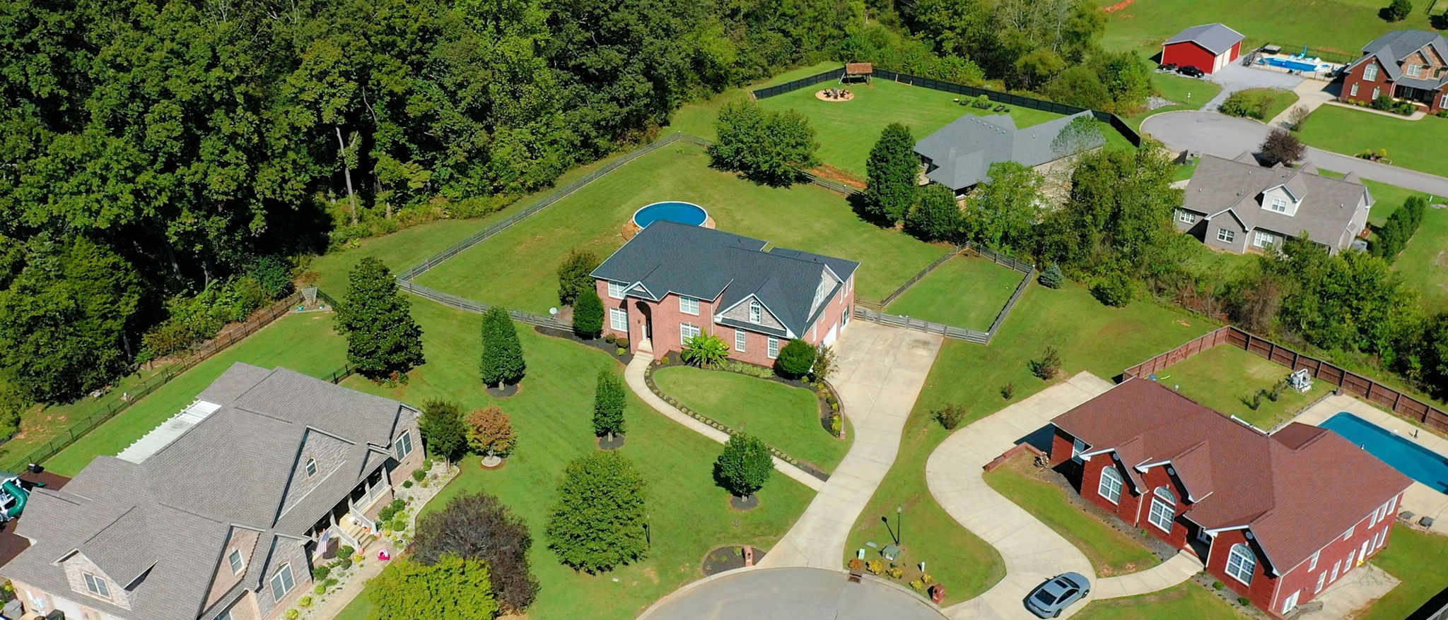 Step inside this stunning all-brick home & prepare to be WOWed by its sheer space & thoughtful design - boasting of 5,600 sq ft, including 4 official bedrooms & 3.5 baths w/multiple additional rooms that could easily serve as guest suites, hobby rooms and/or additional bedrooms - providing versatility to fit ANY lifestyle. Make sure you check out the VIRTUAL TOUR!!! - You'll see the finished basement includes a large rec room w/fireplace, the 3rd full bath, wet bar & a spacious room currently used as a bedroom w/door opening to a beautiful courtyard - making the basement perfect for entertaining or multi-generational living. On the main level, you'll find soaring ceilings in the grand living room, a formal dining room, an office, a bright sunroom, as well as a MASSIVE primary bedroom featuring an ensuite w/whirlpool tub & separate shower. Upstairs offers 3 large bedrooms, a full bath, and spacious bonus/media room ideal for movie nights, a playroom, or yet another potential bedroom. Enjoy outdoor living at its best with a huge screened-in porch, covered patio, and a deck overlooking the nearly one-acre, level, fenced yard - set above neighboring homes - so no one's looking into your yard! Relax by the above-ground pool and enjoy the peaceful surroundings - tons of mature trees along one side of backyard. Additional highlights include a brand-new roof, three-car garage, concrete driveway, fresh paint throughout most of the house, natural light galore, a solid cinder block room used as a storm room in the basement & an additional electrical box outside (100 amp) - supporting additional outside lighting, & future hot tub or shed electricity. Nestled quietly on a cul-de-sac within a highly desired, established neighborhood, this home offers a rare blend of space for living, entertaining & relaxing - it truly has it all! Don't miss this one!

Buyer & Buyer's Agent to verify all important information.