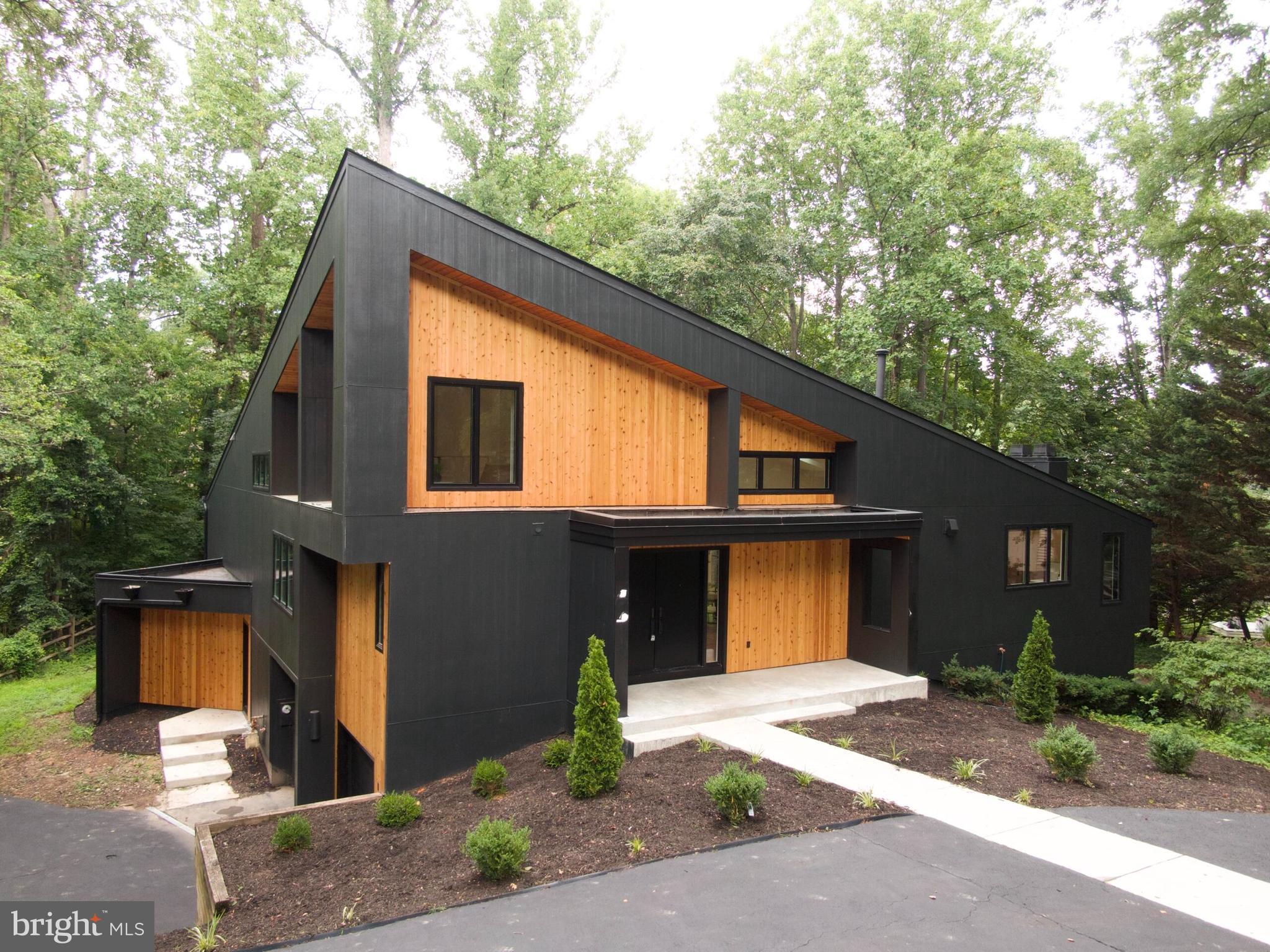 Discover a rare opportunity to own a fully renovated contemporary single-family home steps from Lake Newport in Reston, Virginia. Perfectly positioned just moments from the water, this architectural residence offers approximately 4,400+ square feet of thoughtfully designed living space, blending modern luxury with one of Northern Virginia's most desirable outdoor lifestyles.Dramatic ceilings soaring nearly 20 feet, expansive walls of glass, and an oversized wraparound deck capture tranquil wooded surroundings and beautiful seasonal views of Lake Newport, creating seamless indoor-outdoor living.Completely reimagined with exceptional craftsmanship, the home features a stunning chef's kitchen anchored by a 10-foot waterfall island, custom cabinetry, premium JennAir appliances, quartz countertops with a full-height quartz backsplash, designer lighting, and an open-concept floor plan ideal for entertaining. Additional upgrades include 7.5-inch wide-plank hardwood flooring, spa-inspired designer bathrooms, oversized walk-in closets with custom organization, and a finished 2-car garage. Located in the heart of Reston, residents enjoy direct access to Lake Newport, scenic walking and biking trails, parks, tennis courts, pickleball courts, pools, and the extensive Reston Association amenities. This exceptional location is just minutes from Reston Town Center, the Wiehle-Reston East and Reston Town Center Silver Line Metro Stations, Wegmans, Reston National Golf Course, and countless restaurants, shopping, and entertainment options.Commuters will appreciate convenient access to the Dulles Toll Road (Route 267), Route 7 (Leesburg Pike), Fairfax County Parkway, Tysons Corner, Dulles International Airport, and downtown Washington, D.C.Whether you're searching for a luxury home near the water, a modern home in Reston, or a contemporary lake-view property with exceptional design, this residence offers a truly one-of-a-kind lifestyle , truly a hidden gem in Northern Virginia's premier lake communities! **Deadline July 18th at 5pm**
