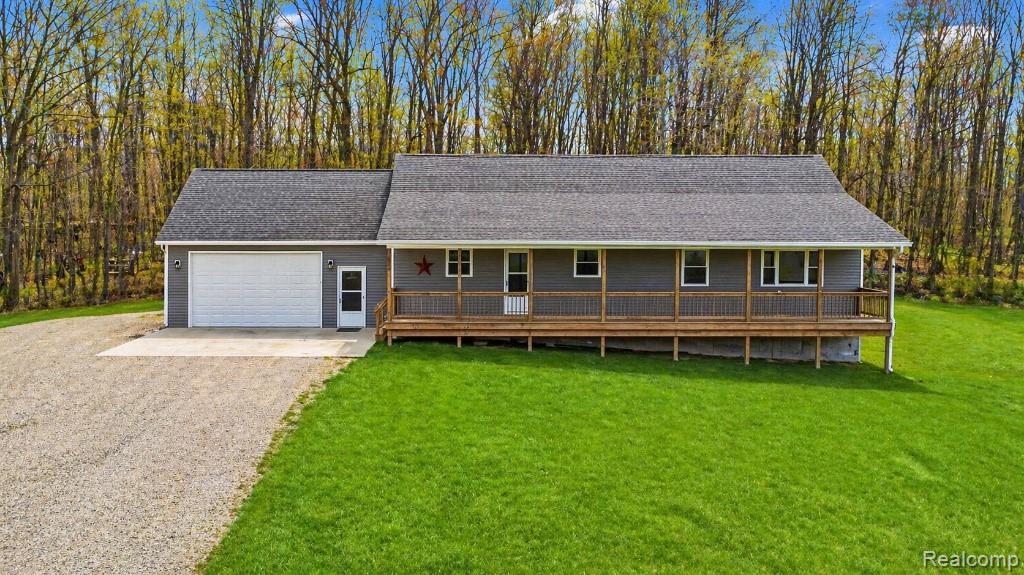 Welcome to a rare opportunity in Metamora, Michigan. This beautiful ranch home is situated on 19.47 acres of breathtaking land featuring a private pond. With 3,300 square feet of finished living space, the residence includes 4 bedrooms, 3 full baths, and 1 half bath. The interior has been fully updated with endless custom features and an open concept layout throughout. The kitchen is designed for entertaining, boasting custom cabinets, granite countertops, a tile backsplash, and a huge island. Solid oak floors flow through the main living areas, adding warmth and elegance. The home also includes a full finished walkout basement with an egress window, offering additional versatile space. Outside, the large covered front porch provides endless views of the gorgeous property and the impressive pond. Abundant wildlife makes it a hunter’s dream, with frequent sightings of deer and other game. Property this size in such a prime location will not last long. 1 Year Home Warranty included with sale!