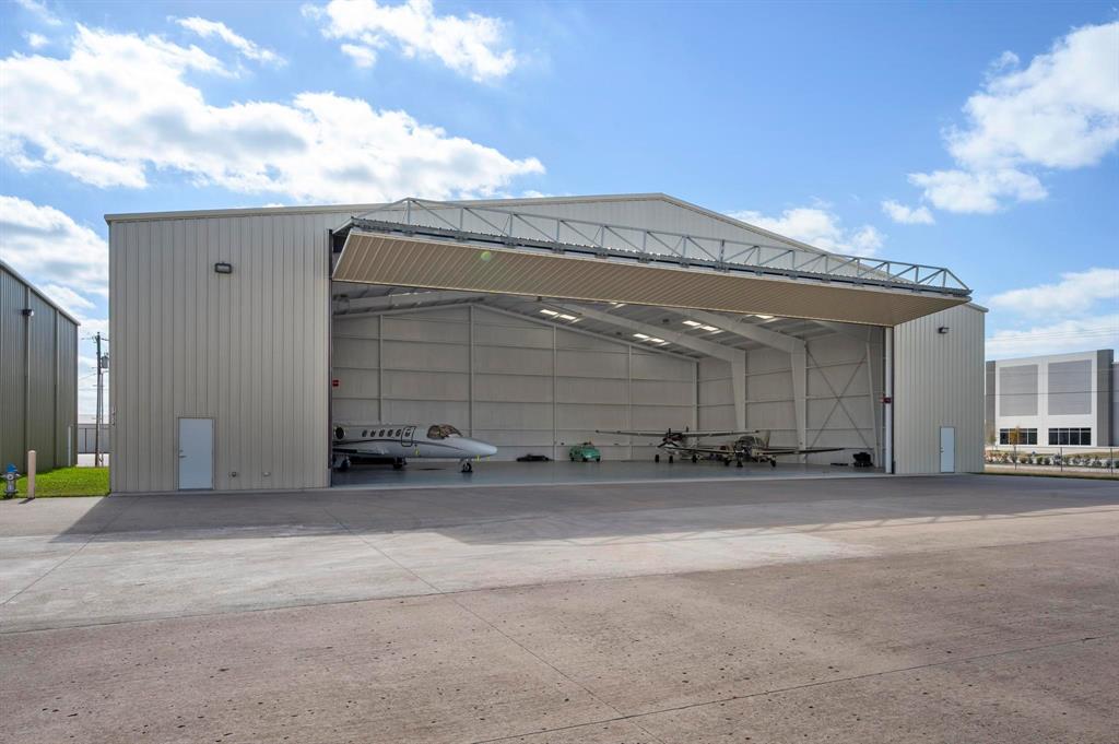 1434 Airport Blvd, Mesquite, Texas 75181 ~ 9,600 SF Corporate Hangar Facility at Mesquite Metro Airport (KHQZ) ~ Corporate hangar available for purchase at Mesquite Metro Airport. The hangar was built in 2022 and is in excellent condition, ready for your corporate or private aircraft! Overall hangar dimensions are 120' wide X 80' deep; Schweiss brand electric bi-fold hangar door has a 80' wide x 22' tail clear height. The hangar will accommodate most mid-size jets and turbo-props.  The property would make a great corporate flight department. Hangar amenities include an epoxy hangar floor, white painted red-iron, LED lighting, fully insulated, industrial overhead fan, restroom and storage room. Located inside the secure gated portion of the airport with access to the 6,000' x 100' runway 18~36.Airport ground lease with City of Mesquite through March 2046.Hangar use restrictions: Aircraft storage. Commercial business use of hangar is strictly prohibited.