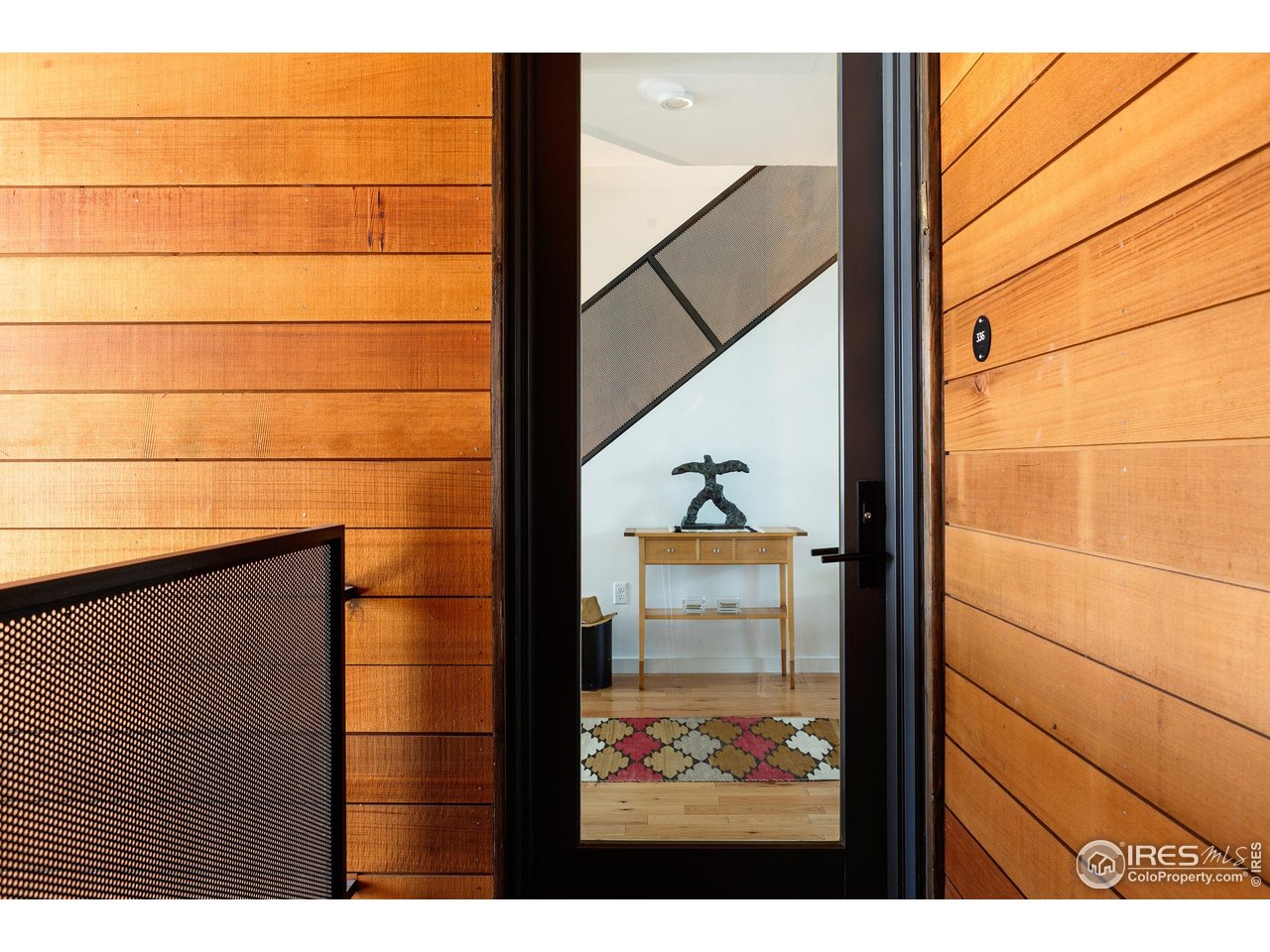 SELLERS OFFERING UP TO $5,000 in CONCESSIONS to be used towards closing costs or rate buy down!! Step into this bright, modern 2-bedroom, 2-bath end-unit condo built in 2019 in the vibrant Confluence neighborhood. At 1,292 square feet, the home feels remarkably spacious and welcoming, thanks to an abundance of windows that bathe every room in warm natural light from sunrise to sunset. The open-concept main level flows effortlessly for both everyday living and effortless entertaining. Gleaming hardwood floors run throughout the living and dining areas, while the show-stopping kitchen features crisp quartz countertops, stainless steel appliances, a sleek induction cooktop, and clean contemporary cabinetry. Whether you're hosting friends or whipping up a quiet weeknight dinner, this space inspires. Just off the living area, your private south-facing balcony is the perfect perch for morning coffee with mountain views or golden-hour cocktails. Upstairs, the primary suite offers a peaceful retreat with soaring ceilings, generous windows, and a luxurious 3/4 bath featuring dual quartz vanities. The second bedroom is thoughtfully designed with a built-in workstation and Murphy bed-easily transforming from a cozy guest room to a productive home office. Residents enjoy outstanding shared amenities, highlighted by the stunning rooftop deck complete with a kitchenette, BBQ grill, and panoramic views of Fort Collins' skyline and the distant foothills. Additional perks include secure bike storage, a private locker, a convenient dog wash station, and inviting outdoor gathering spaces.You're literally steps from Old Town's best restaurants, craft breweries, boutique shops, and scenic trails along the Poudre River. This isn't just a condo-it's a lifestyle of convenience, thoughtful design, and community connection in the heart of Fort Collins. Priced below market value to move quickly. Schedule your private tour today and discover why this could be your next chapter in Old Town.