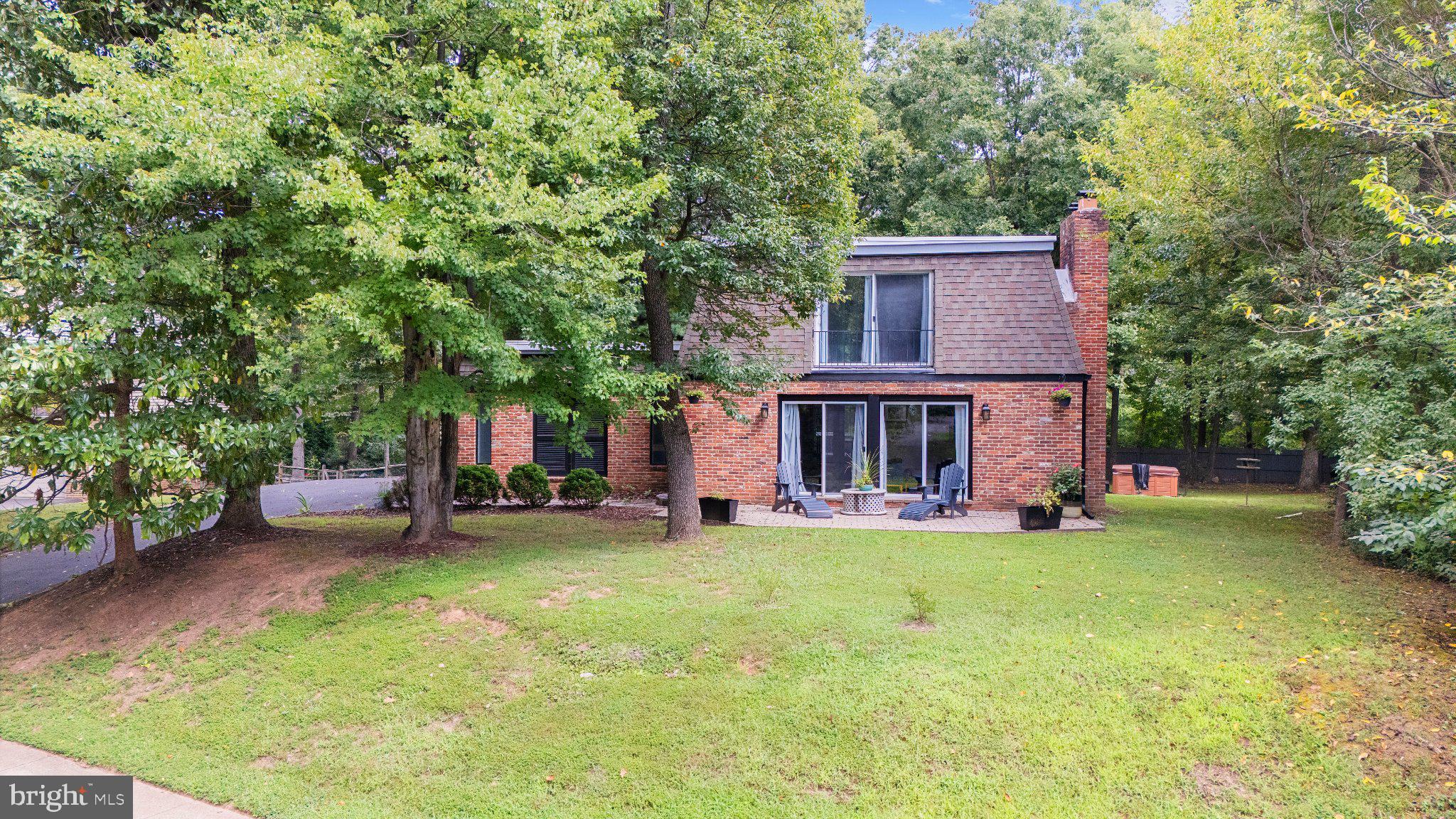 Nestled in the prestigious Reston community, this stunning Mid-Century Modern residence offers an exclusive lifestyle defined by elegance and comfort. Built in 1968, this meticulously maintained home spans 2,184 square feet and is set on a generous 0.36-acre lot, providing ample space for both relaxation and entertainment. Step inside to discover a warm and inviting atmosphere, accentuated by beautiful hardwood flooring that flows seamlessly throughout the main living areas. The heart of the home features a thoughtfully designed galley kitchen, equipped with high-end appliances including a cooktop, dishwasher, and refrigerator, ensuring that culinary enthusiasts will feel right at home. With four spacious bedrooms and three and a half bathrooms, this residence offers plenty of room for both privacy and togetherness. The master suite is a true retreat, complete with an en-suite bathroom that exudes tranquility. Each additional bedroom is generously sized, providing comfort and versatility for guests or a home office. The living space is further enhanced by three inviting fireplaces, creating cozy focal points in the home. The fully finished basement, accessible via a connecting stairway, offers additional living space and includes a dedicated laundry area, making everyday tasks a breeze. Step outside to enjoy multiple balconies and a spacious deck, perfect for soaking in the serene views of the adjoining golf course. This outdoor oasis invites you to unwind with a morning coffee or host evening gatherings under the stars. Parking is a breeze with an attached carport and additional off-street spaces, ensuring convenience for you and your guests. This exceptional property not only boasts high-end features but also offers a lifestyle of leisure and sophistication. With its prime location adjoining a golf course, residents can enjoy the beauty of nature while being just moments away from the vibrant amenities that Reston has to offer. Experience the perfect blend of luxury and comfort in this exquisite home, where every detail has been thoughtfully curated for an unparalleled living experience.