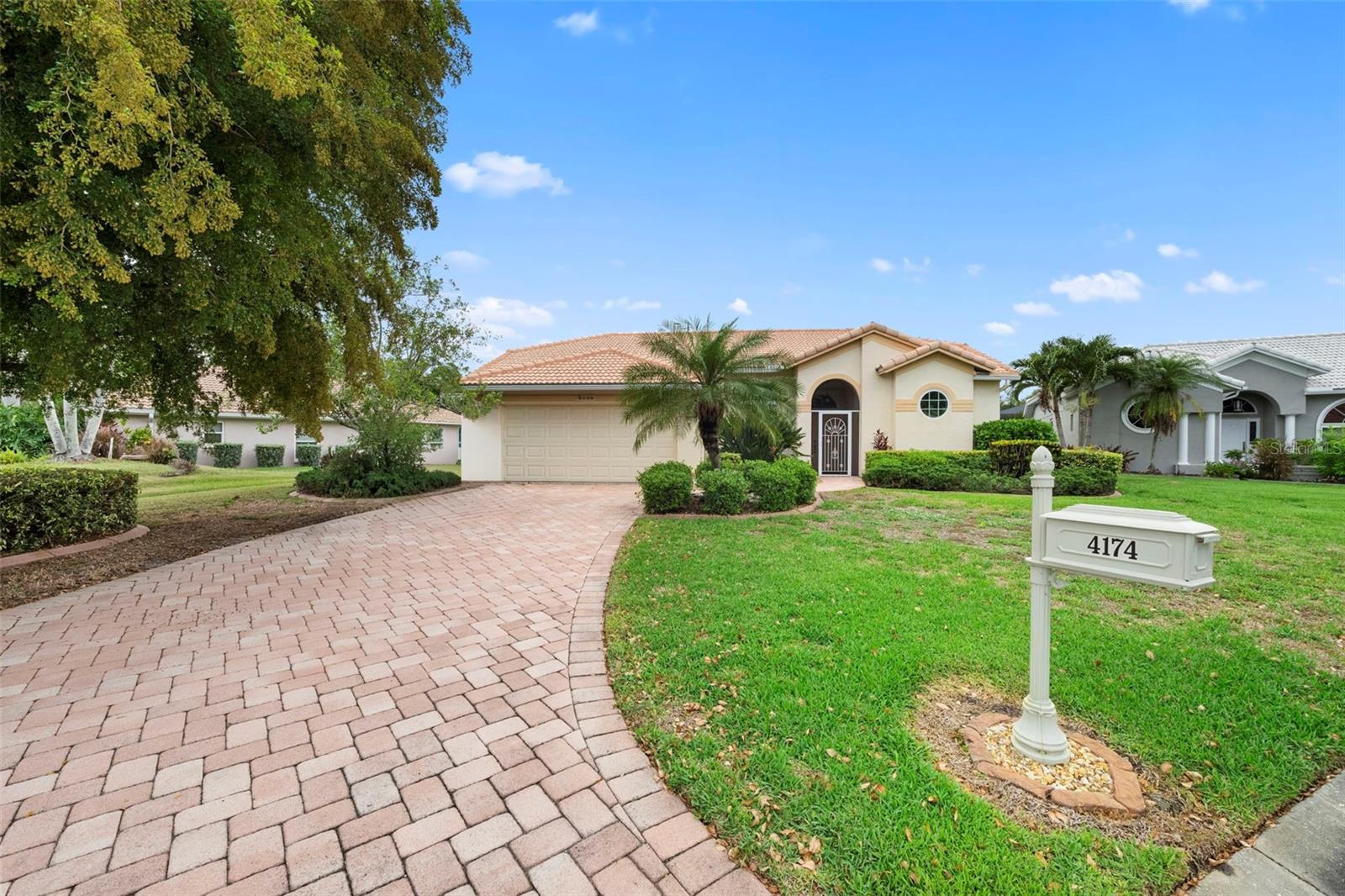 WATERFRONT POOL HOME in a gated community just minutes from Siesta Key Beach! This TURNKEY move-in-ready 3-bedroom, 2-bath residence offers the Florida lifestyle buyers are searching for, with tranquil water views, a private screened pool, hurricane-impact windows, and low HOA fees. Situated on a cul-de-sac in sought-after Huntington Pointe, this beautifully maintained home features soaring ceilings, abundant natural light, luxury vinyl plank flooring throughout, and an open-concept layout designed for comfortable everyday living and effortless entertaining. The spacious kitchen features newer appliances and flows seamlessly into multiple living and dining areas, all oriented toward the screened lanai and peaceful waterfront setting. The primary living spaces capture beautiful pool and water views, creating a bright and inviting atmosphere throughout the home. Outside, enjoy your private screened lanai and pool overlooking the water—perfect for morning coffee, outdoor dining, or relaxing Florida evenings. Additional features include hurricane-impact windows, a paver driveway, low-maintenance finishes, and a well-kept community setting. Conveniently located near shopping, dining, medical facilities, Publix, Costco, Target, and Lowe's, with world-famous Siesta Key Beach just 7 miles away. HVAC 2016, roof 2015, impact windows 2014, repipe 2004, pool cage 2020