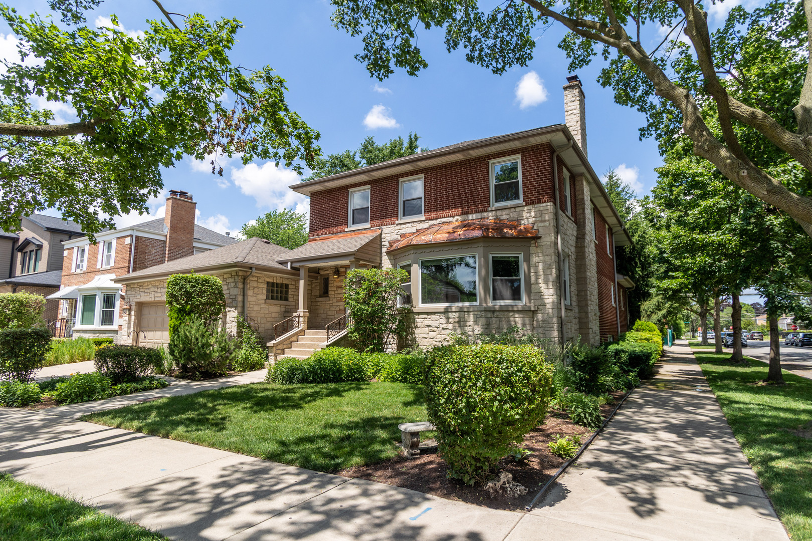 Spacious & versatile 5BR/4BA home on a prime corner 65 foot lot! This beautifully maintained residence offers 3 fully finished levels with endless flexibility. Main level features a massive light-filled living room, formal dining room, large kitchen with pantry, sun-room, office, powder room, eat-in Kitchen and laundry area. Upstairs offers 4 generous bedrooms including a spacious primary suite, bonus room, and private balcony. Fully finished lower level includes a huge family room, second full kitchen, additional bedroom, full bath, and abundant storage. Attached 2-car garage. Exceptional natural light, great curb appeal, and thoughtful layout throughout.