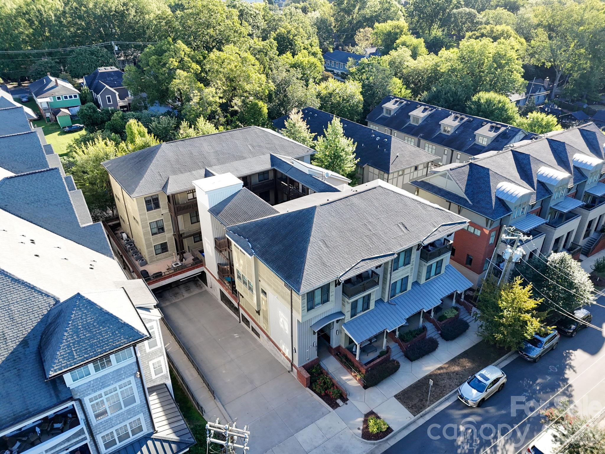 Welcome to the heart of Dilworth!  This beautifully situated 2 bedroom, 2.5 bath condo features dual primary suites, offering flexibility and privacy for residents and guest alike.  Located in a gated, secure community, this home offers convenient access to a parking garage and a welcoming courtyard setting.  Inside, you'll find new paint and carpet, beautiful wood flooring, and a well appointed kitchen featuring stainless steel appliances, a center island and pendant lighting.  The open living area provides a comfortable space for relaxing or entertaining, with access to a private rear balcony.  Both spacious primary suites offer spacious closets and private baths with tile showers, providing comfort and convenience.  Washer and dryer are included making this home truly move in ready.  Ideally located with walkability to Dilworth's restaurants, shopping, parks, light rail, and all that Charlotte has to offer.  This condo combines low maintenance living with an unbeatable location.