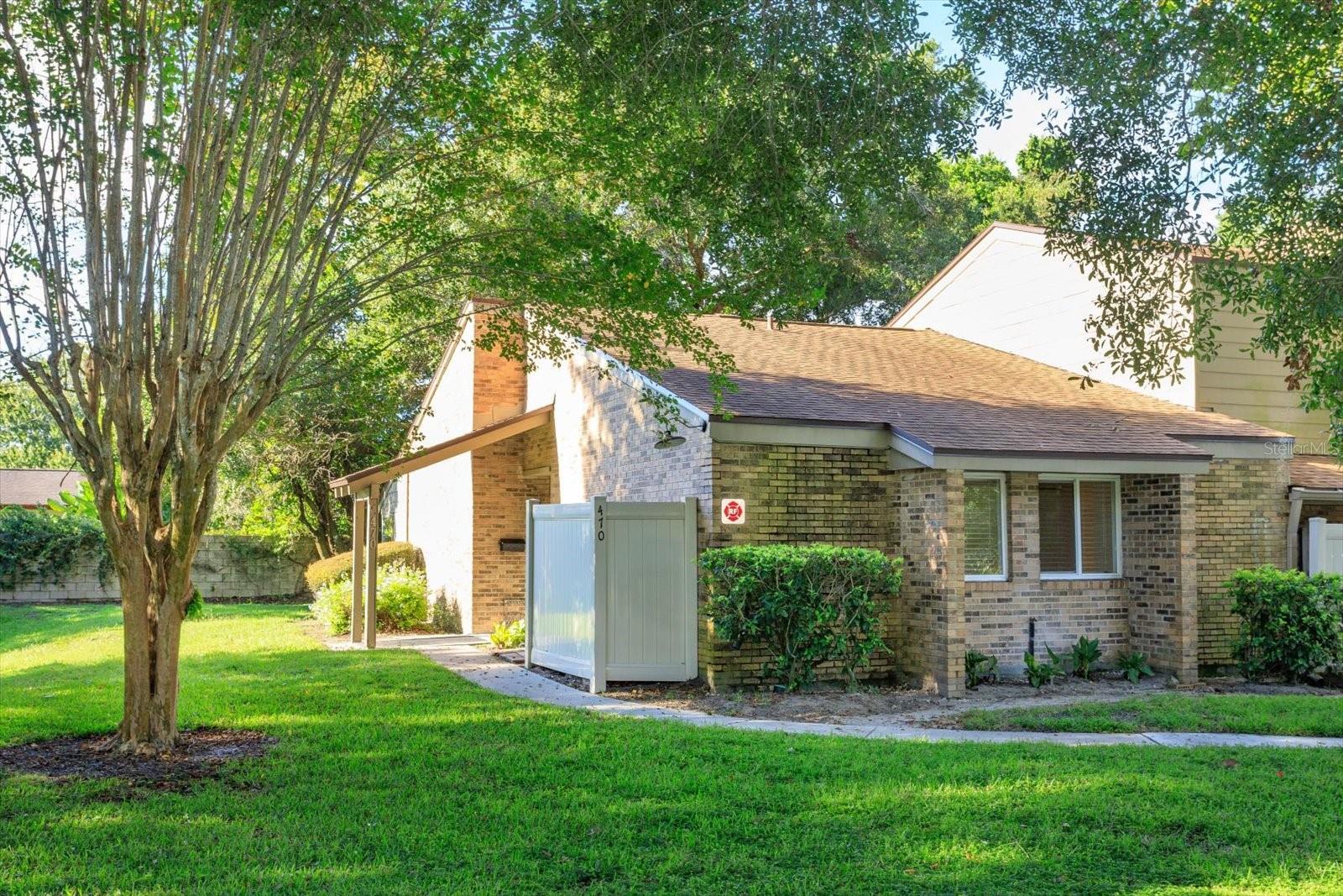 One or more photo(s) has been virtually staged. LAKEFRONT GATED COMMUNITY - Welcome to this exceptional residence, nestled within the desirable OAK HARBOUR community in Altamonte Springs!  This stunning 2-Bedroom / 2-Bath - FIRST FLOOR END UNIT offers the ultimate in privacy and comfort, with no one above and no rear or side neighbors.  Step inside and be captivated by the soaring VAULTED WOOD CEILING in the living room, creating an expansive and inviting atmosphere.  The home boasts a FULLY REMODELED KITCHEN AND BATHROOMS, featuring elegant STONE COUNTERTOPS, SOFT-CLOSE SOLID WOOD CABINETS and a convenient PANTRY.  TILE FLOORS extend THROUGHOUT the ENTIRE HOME, complemented by modern, upscale hardware.  The chef's kitchen comes equipped with HIGH-END SAMSUNG KITCHEN APPLIANCES and the convenience continues with a SAMSUNG WASHER and DRYER INCLUDED.  Enjoy peace of mind with all NEW INSULATED WINDOWS AND SLIDER DOORS, perfectly paired with NEW CORDLESS BLINDS THROUGHOUT HOME.  Elegant LIGHTED FANS are thoughtfully placed throughout for comfort and ambiance.  This property offers incredible flexibility with a BONUS FL ROOM, easily transforming into a 3RD BEDROOM, Office/Den, Gym/Play Area or a Creative Studio to suit your needs.  The Primary Bedroom is a private oasis, featuring a spacious WALK-IN CLOSET and an En-Suite Bathroom.  The home has been FULLY UPDATED:  ELECTRICAL, PLUMBING and NEW ROOF ensuring years of worry-free living.  A unique advantage of this section of the community is the allowance for ROOM ADDITIONS, EXTENDED PATIOS, DECKS, and FENCES, offering endless possibilities to customize and expand your dream home.  Another convenience is having your MAIL and PACKAGES DELIVERED DIRECTLY TO YOUR VERY OWN FRONT DOOR.  Discover a vibrant community brimming with resort-style amenities.  The impressive CLUBHOUSE features a full kitchen and bar for entertaining, game rooms with card tables, POOL TABLES, and ping pong, and a patio with BBQ grills overlooking the sparkling pool and the expansive clubhouse lawn leading to Lake Orienta.  Lake life awaits with BOAT PARKING and WATER SPORT RACK STORAGE for Canoes/Paddle Boards/Kayaks and like.   The COVERED DOCK is perfect for fishing, boating, and enjoying a beautiful sunset.  Enjoy not one, but TWO POOLS, as well as PICKLEBALL, TENNIS, and BASKETBALL COURTS for DAY or NIGHT PLAY.  Stay active in the on-site FITNESS CENTER.  The community itself is a picturesque haven with mature trees lining the streets, perfect for biking, walking, and jogging.  Pet lovers will rejoice – all dogs are welcome with no weight or breed restrictions!   Imagine watching spectacular 4th of July fireworks right from the lake or enjoying peaceful moments feeding the ducks.  The community fosters a strong sense of belonging with lots of fun, regular activities for residents of all ages.  Convenience is key, with easy access to shopping, dining, two major airports, public transportation, a renowned hospital and medical center, and a variety of sports and cultural events.  Downtown Orlando is just a 15-minute drive, and the beautiful Atlantic Ocean beaches are within a comfortable 45-minute drive.  Don't miss this rare opportunity to own an updated home with exceptional amenities in a prime Altamonte Springs lakefront community!