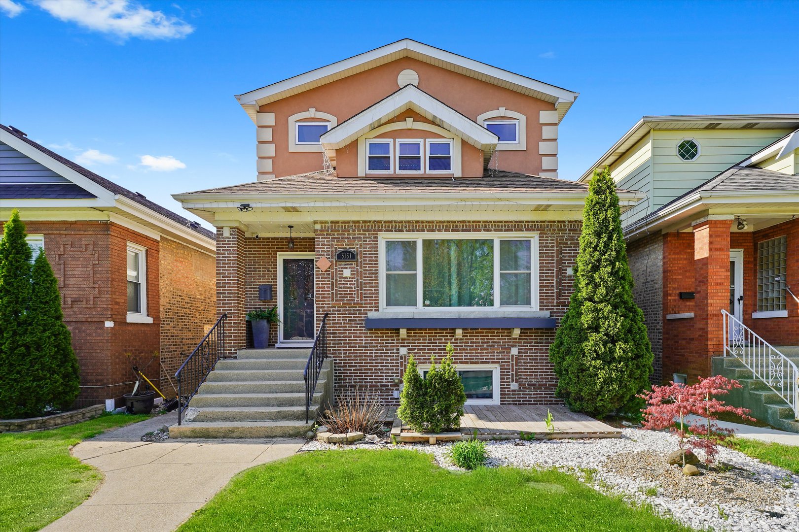 ** Huge Price Reduction **Move right into this stunning, fully updated 6-bedroom, 3-bathroom home in the heart of Belmont-Cragin! Rebuilt in 2015, Refeshed 2025. This spacious gem combines modern updates, flexible living space, and exceptional value in one of Chicago's most convenient neighborhoods.    From the moment you enter, you'll love the sun-filled open layout, beautiful hardwood floors, and elegant wood-and-iron staircase that sets the tone for the rest of the home. The thoughtful floor plan includes 3 spacious bedrooms upstairs, 1 on the main level, and 2 more in the fully finished basement-ideal for multi-generational living, guests, or a private in-law suite.    The kitchen is a true showpiece, featuring on-trend slate blue-gray cabinets, granite countertops, a large center island, and a stylish mosaic backsplash. It flows seamlessly into the dining area, making entertaining effortless. Just off the kitchen, the enclosed back porch offers space for a home office, playroom, or peaceful retreat.    Enjoy the convenience of laundry on the second floor and a second washer/dryer in the basement. Downstairs, the fully finished lower level includes a second kitchen, family room, full bath, and 2 bedrooms-making it perfect for extended family or rental potential.    Outside, relax in your private, fenced backyard with a patio and pergola-perfect for summer BBQs or quiet mornings. A 2.5-car garage gives you all the storage and parking space you need.    Tucked away on a quiet, tree-lined street with friendly neighbors, this home has been lovingly maintained and is truly move-in ready. Homes like this don't come around often. Schedule your showing today before it's gone!