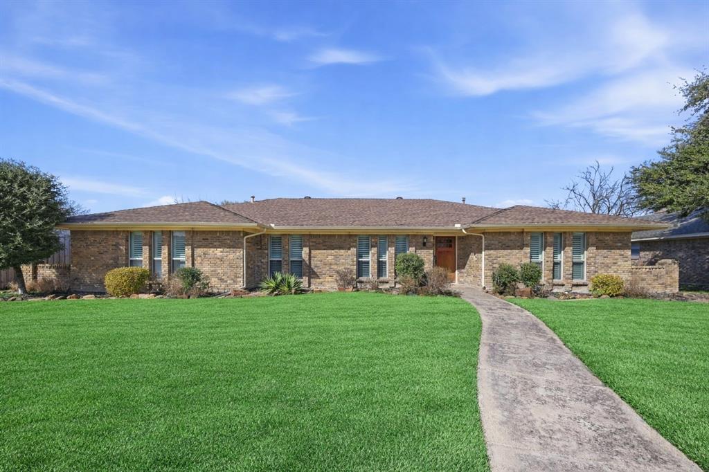 Stunning single-story 4-bedroom home perfectly positioned in the heart of Plano and delivers both style and functionality at every turn. A welcoming formal living and dining area offers flexible space ideal for entertaining. The open-concept family room is anchored by engineered hardwood flooring, a floor-to-ceiling brick fireplace, and vaulted beamed ceilings. The kitchen features stainless steel appliances, a gas cooktop, a large island, and under-cabinet lighting that highlights the granite countertops and designer backsplash. Step outside and enjoy a true backyard retreat with travertine decking, a covered patio, built in gas grill, board-on-board privacy fencing, artificial turf, and a sparkling pool and spa.