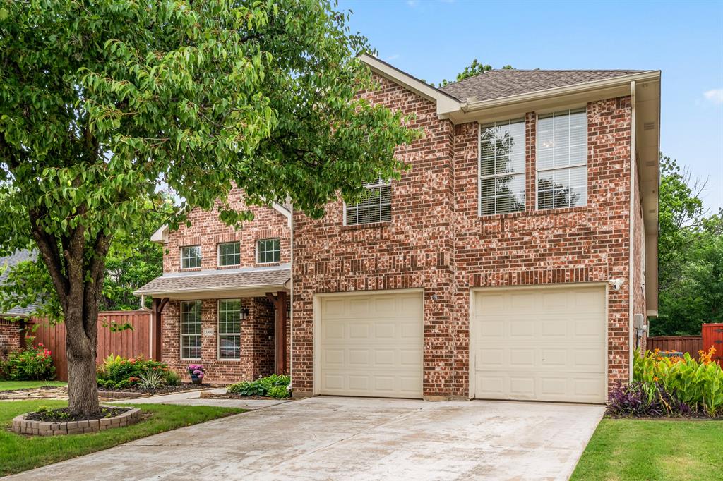 Nestled in a quiet, family-friendly neighborhood of Timberview Estates in Flower Mound within Lewisville ISD, this beautifully maintained 4-bedroom, 2.5-bath home offers both style and functionality. The property features a professionally landscaped yard with mature trees, creating a welcoming curb appeal. Wait until you see the backyard which is the true gem at this house! Inside, you'll find a large living room filled with natural light, hardwood floors, and a built-in entertainment center with a cozy fireplace. The expansive kitchen is a chef’s dream, complete with black stainless steel appliances, Convection MW and oven, work island and ample counter space. Fresh paint throughout gives a warm and inviting feel. The primary suite is conveniently located on the first floor and boasts an oversized bathroom with a separate shower, soaking tub, and generous storage. Upstairs, a spacious media room provides the perfect retreat for movie nights, along with three additional bedrooms and two full baths. Step outside to an oversized backyard featuring a large patio and sitting area—ideal for entertaining or relaxing. This home combines comfort, elegance, and convenience in one of the area’s top school districts. Just minutes from the heart of shopping in Flower Mound, this property has it all!